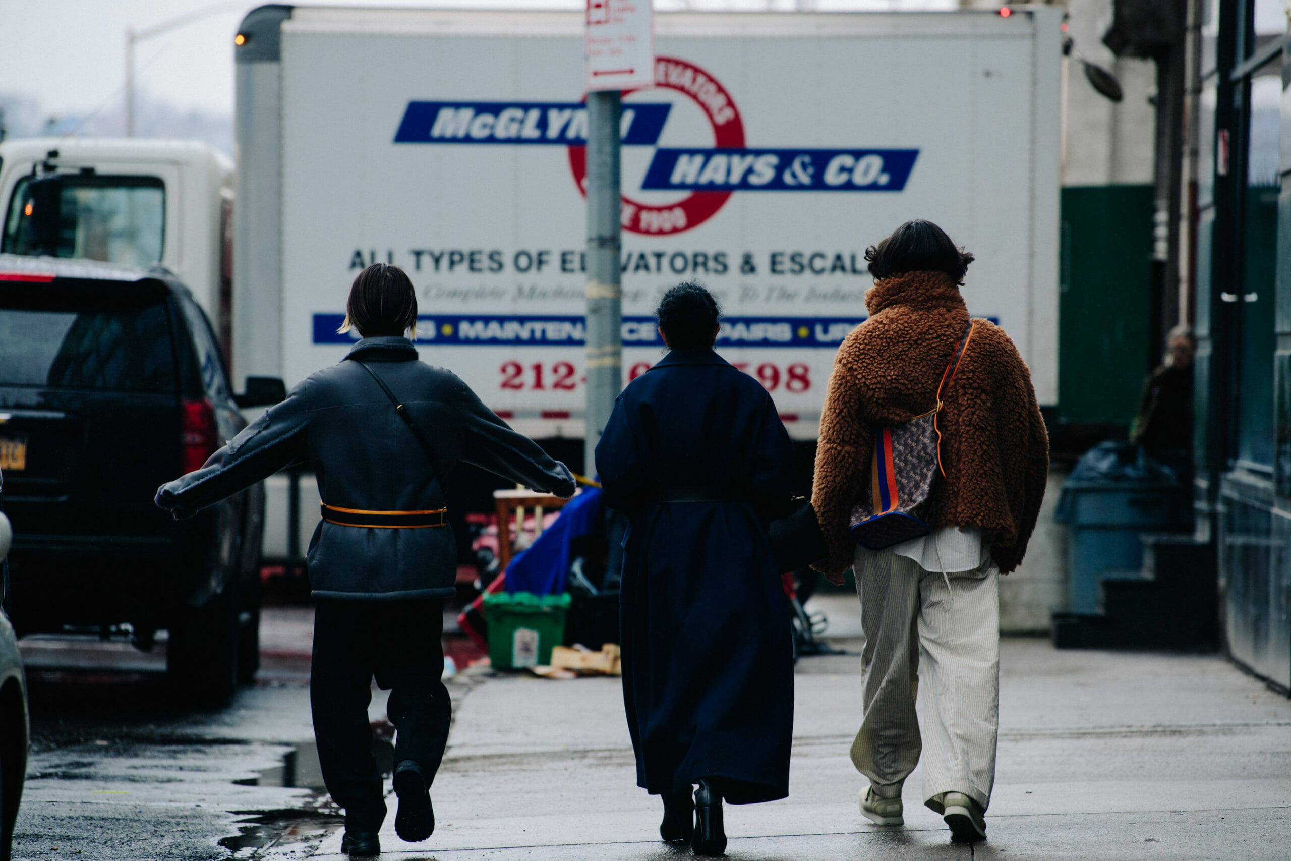 Men carrying Coach bags