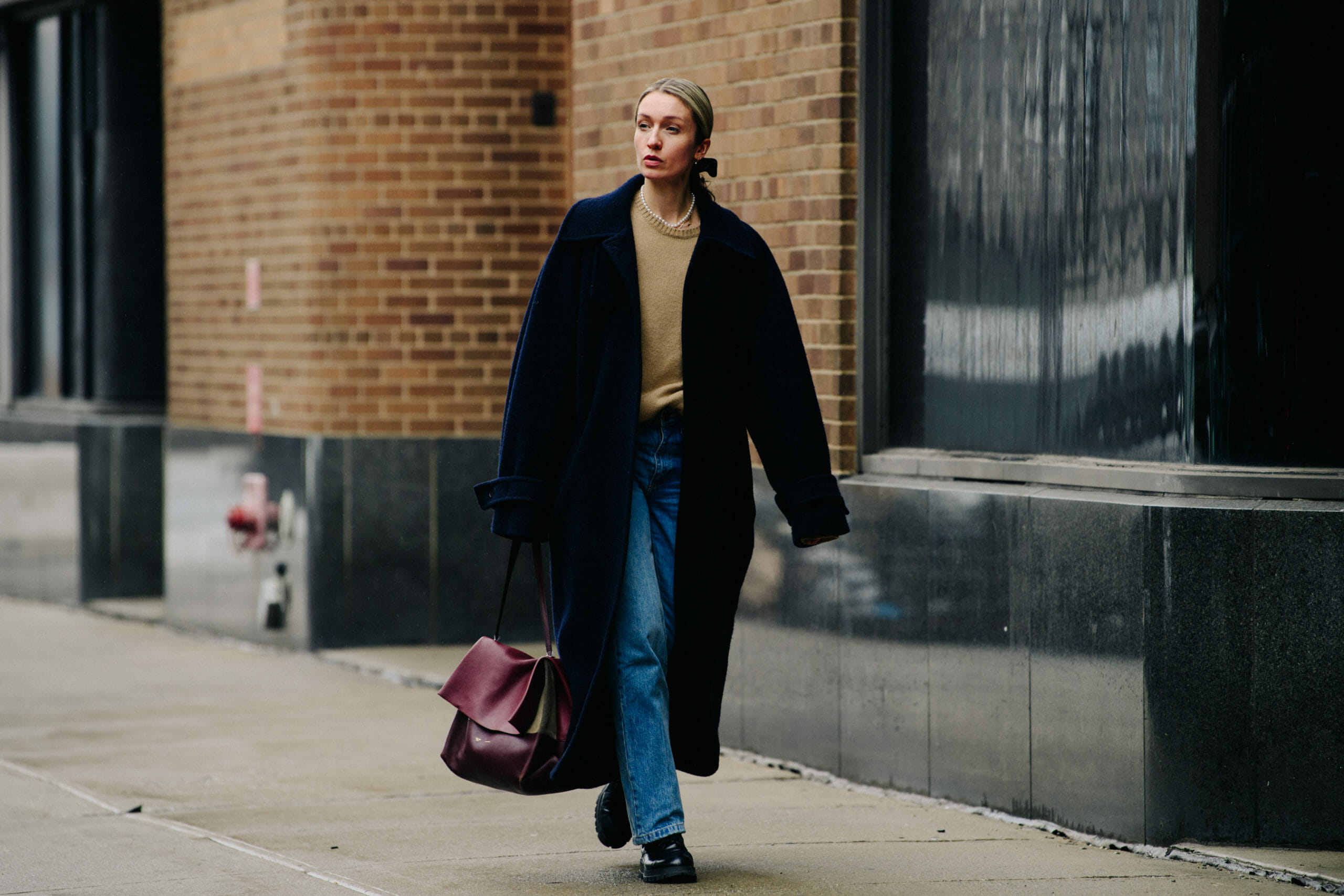 Woman carrying red bag