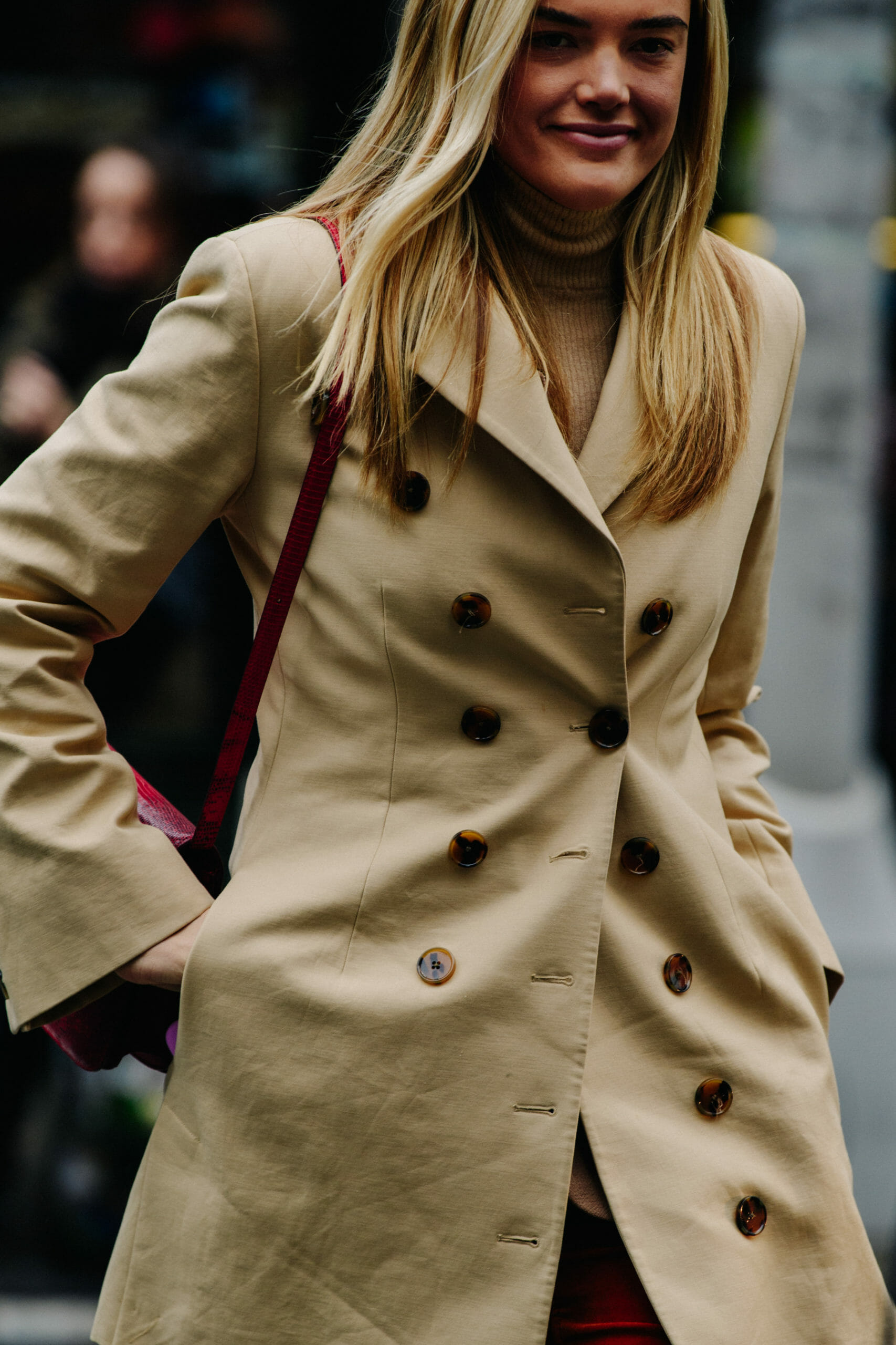 Woman wearing tan coat