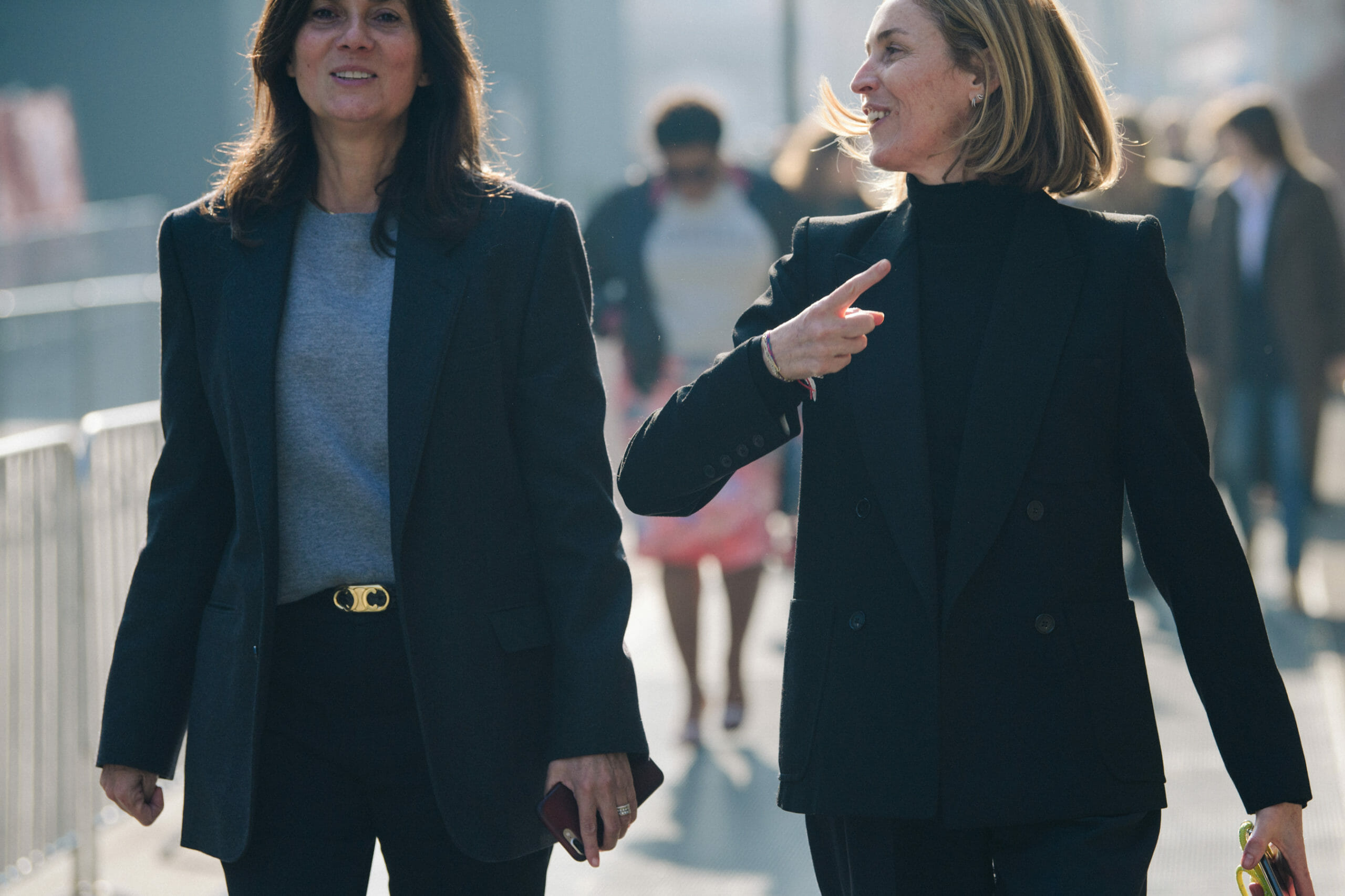 Two women wearing black jackets