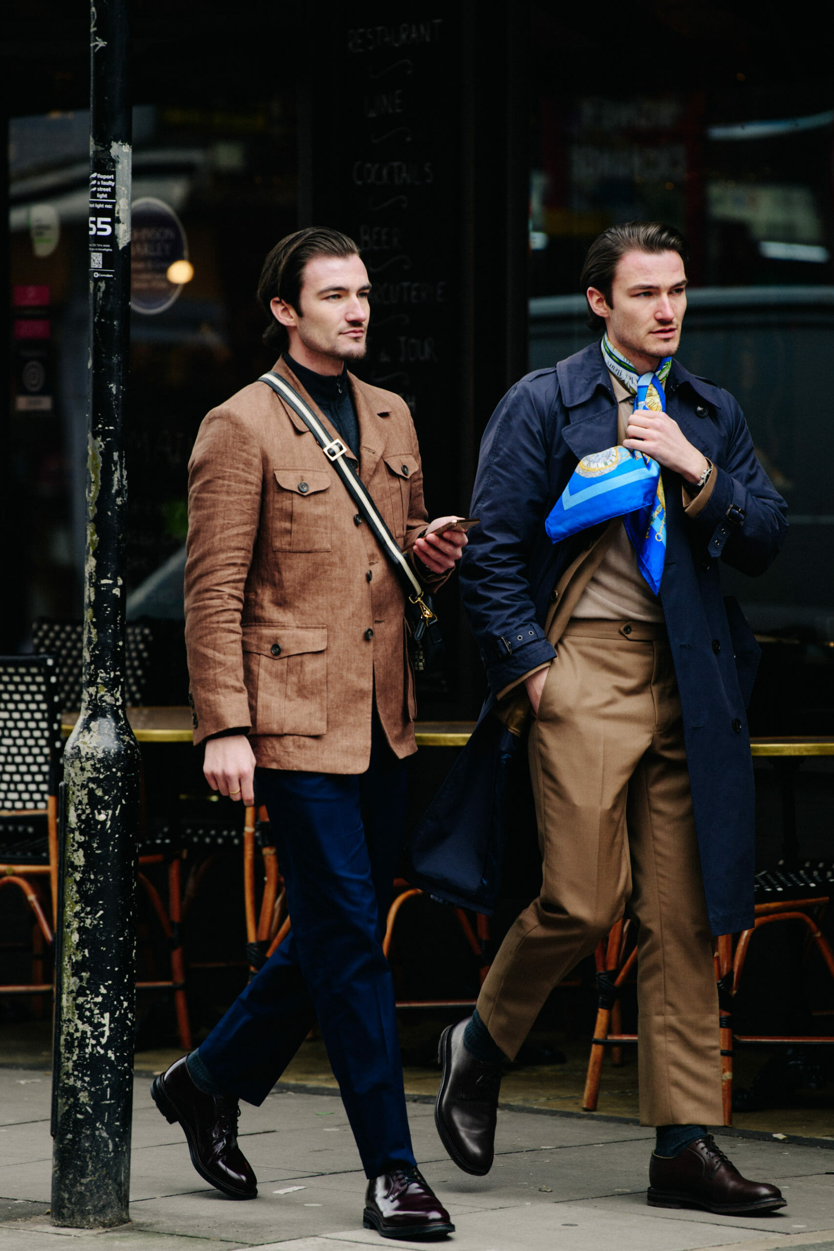 Twins wearing long coats