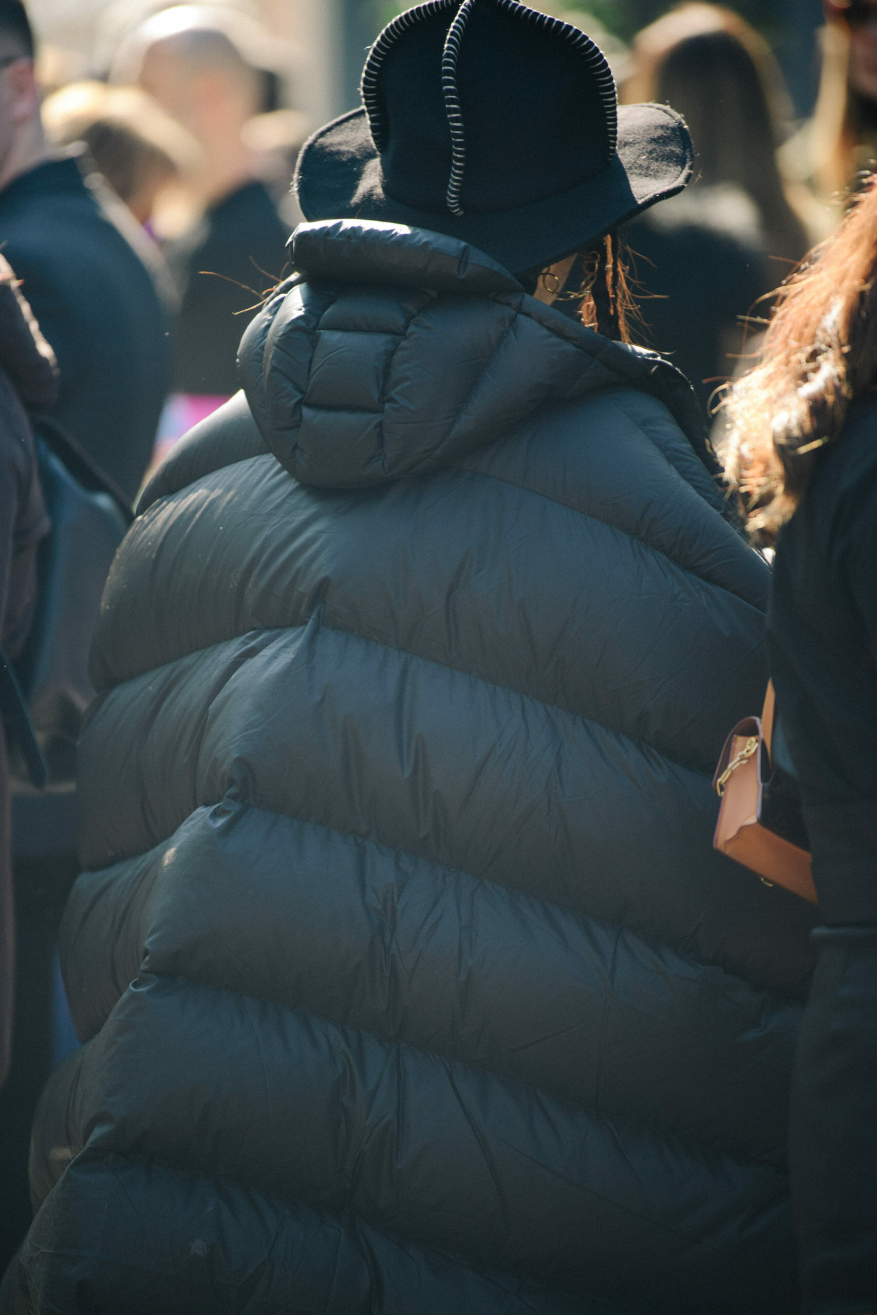 Woman wearing black puffer coat
