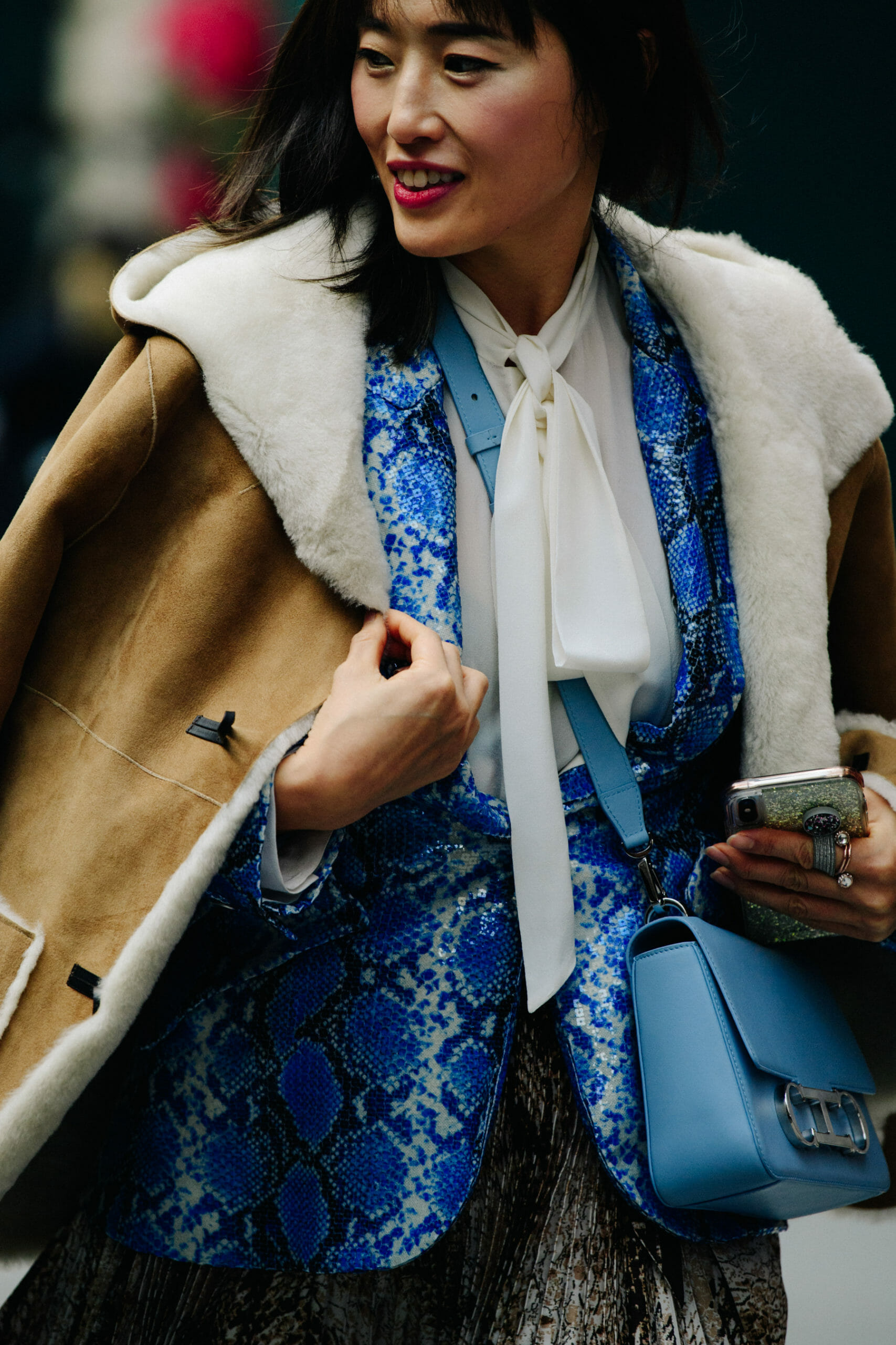 Woman wearing blue snakeskin