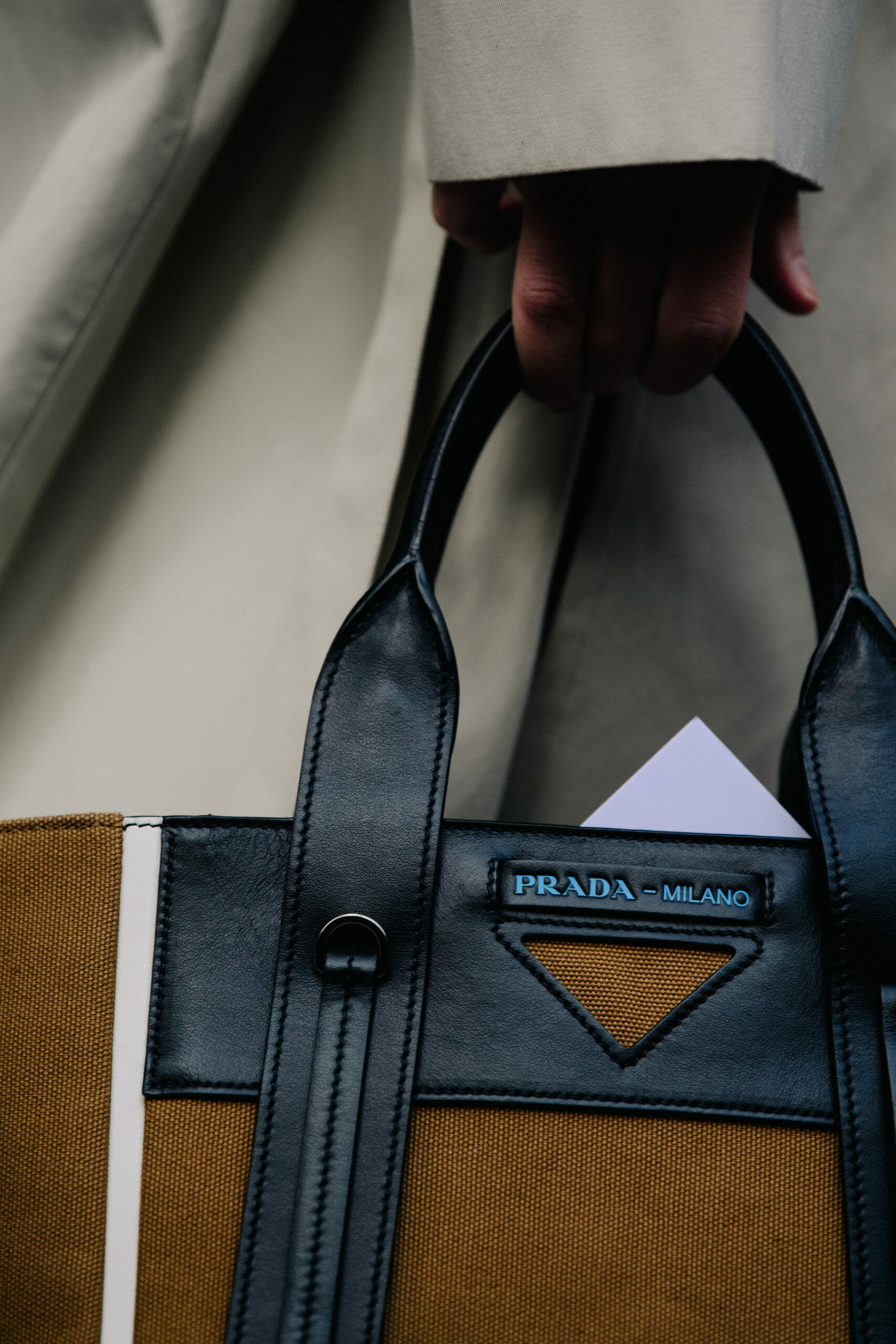 Carrying Prada bag