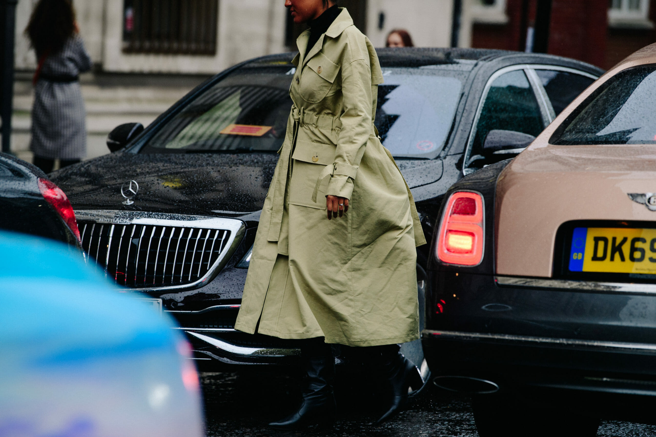 Woman wearing tan coat
