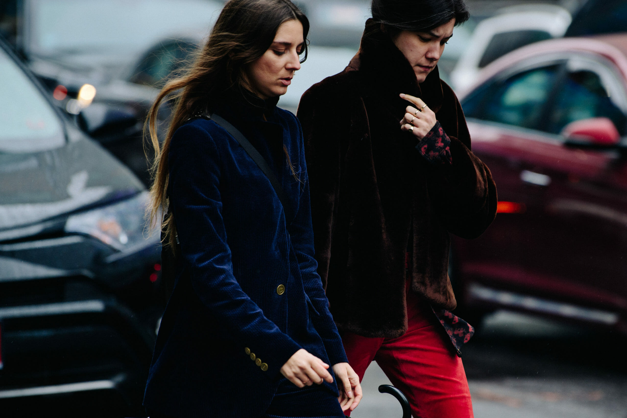 Two women wearing dark jackets