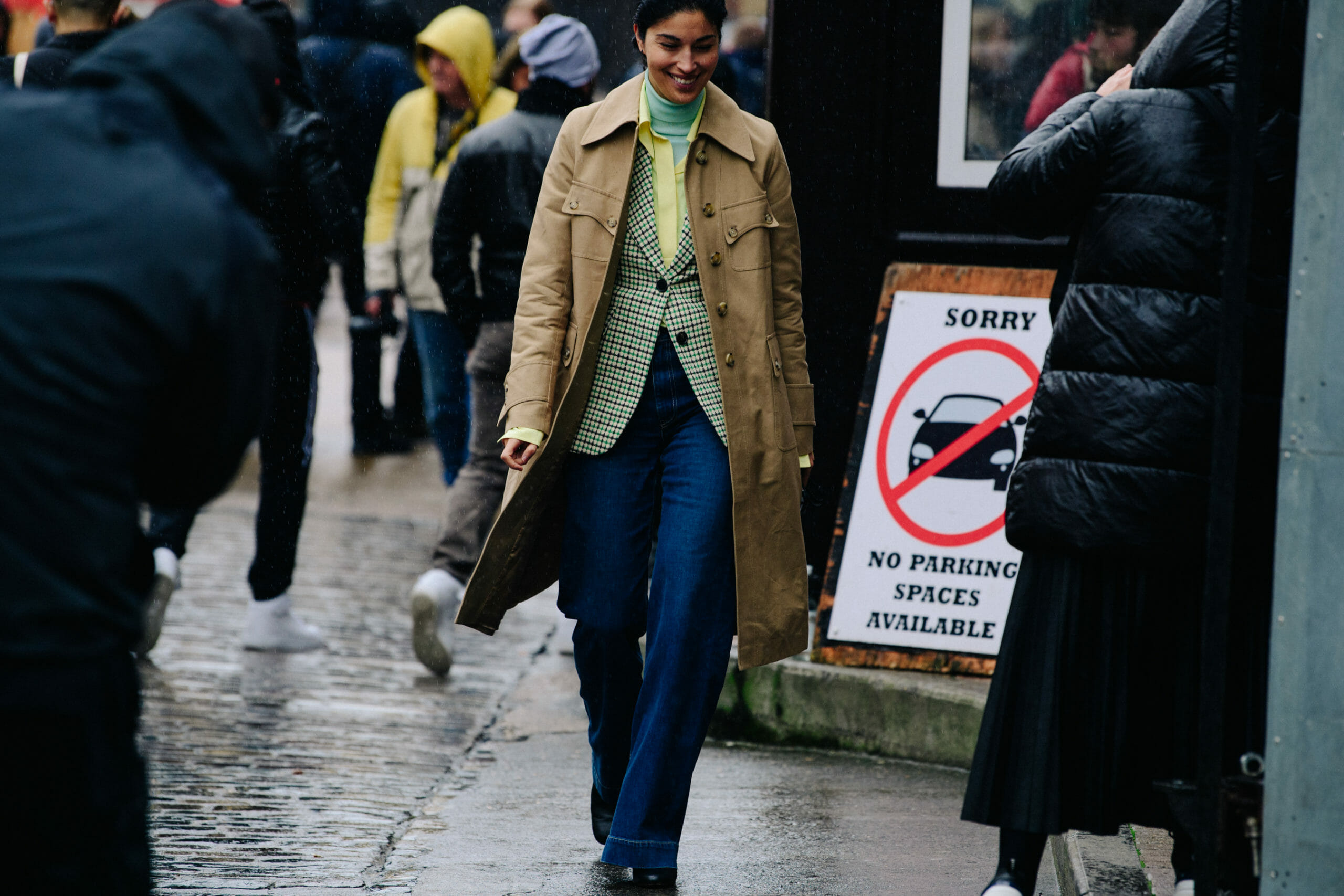 Woman wearing tan coat
