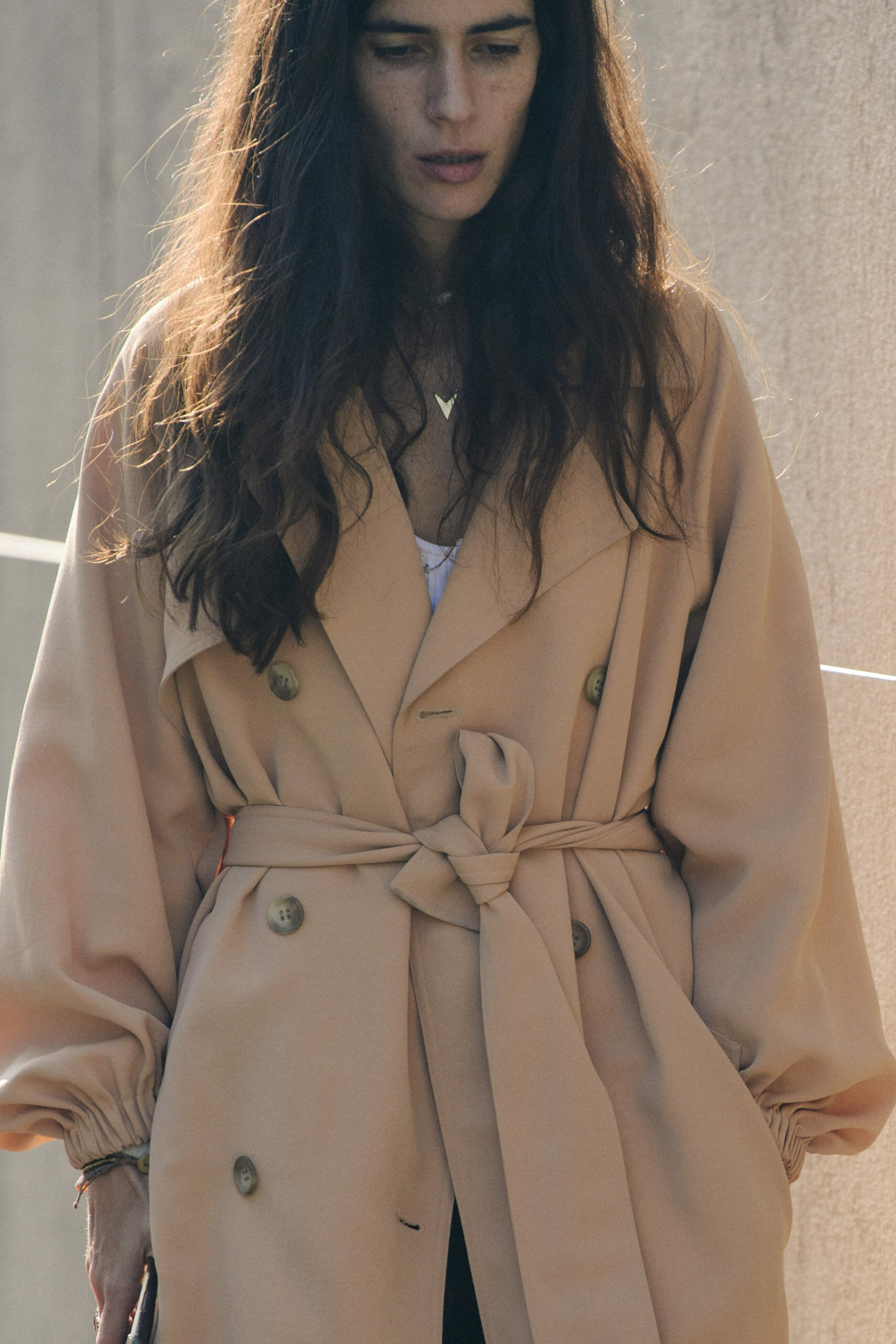 Woman wearing light coat