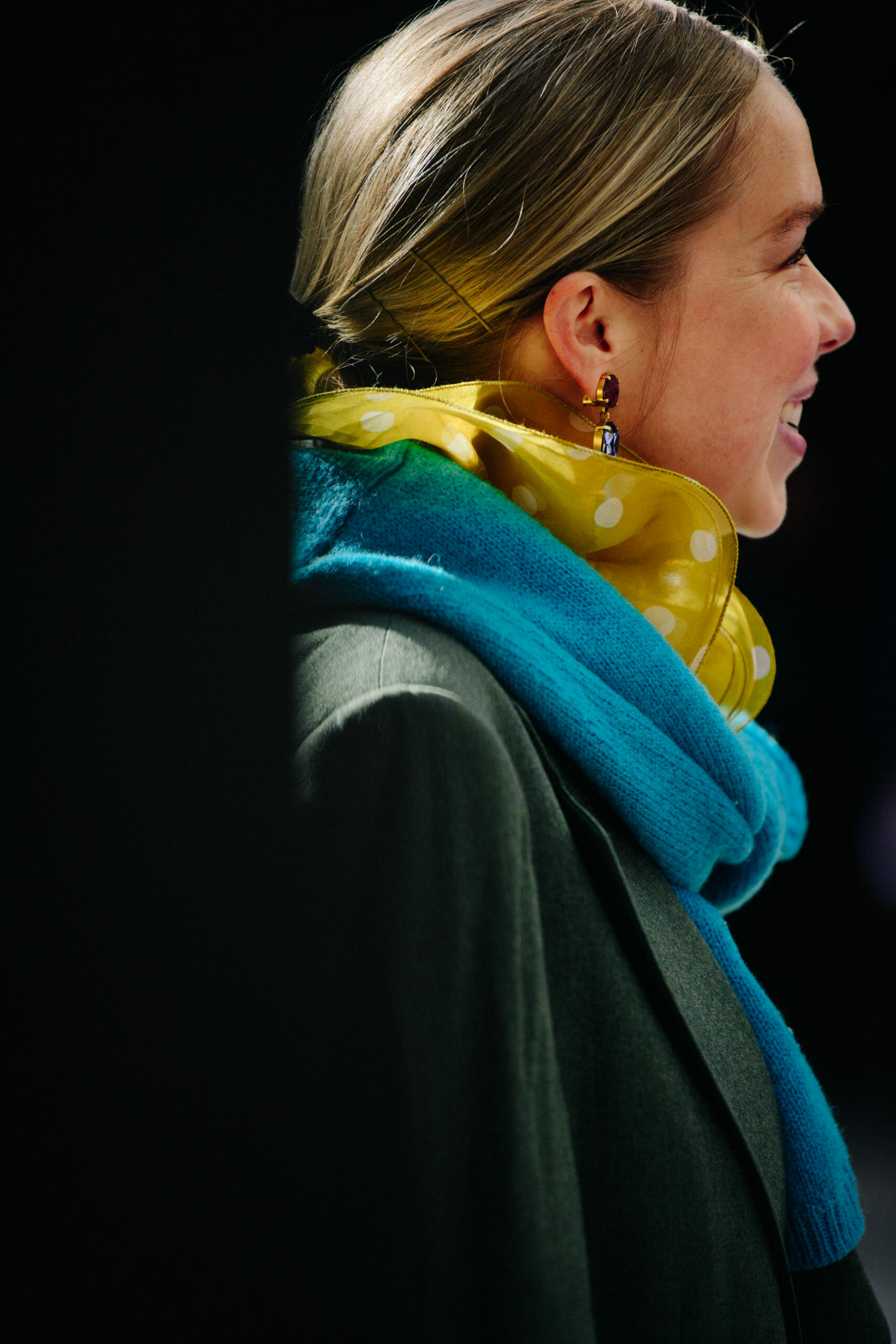 Woman wearing yellow scarf
