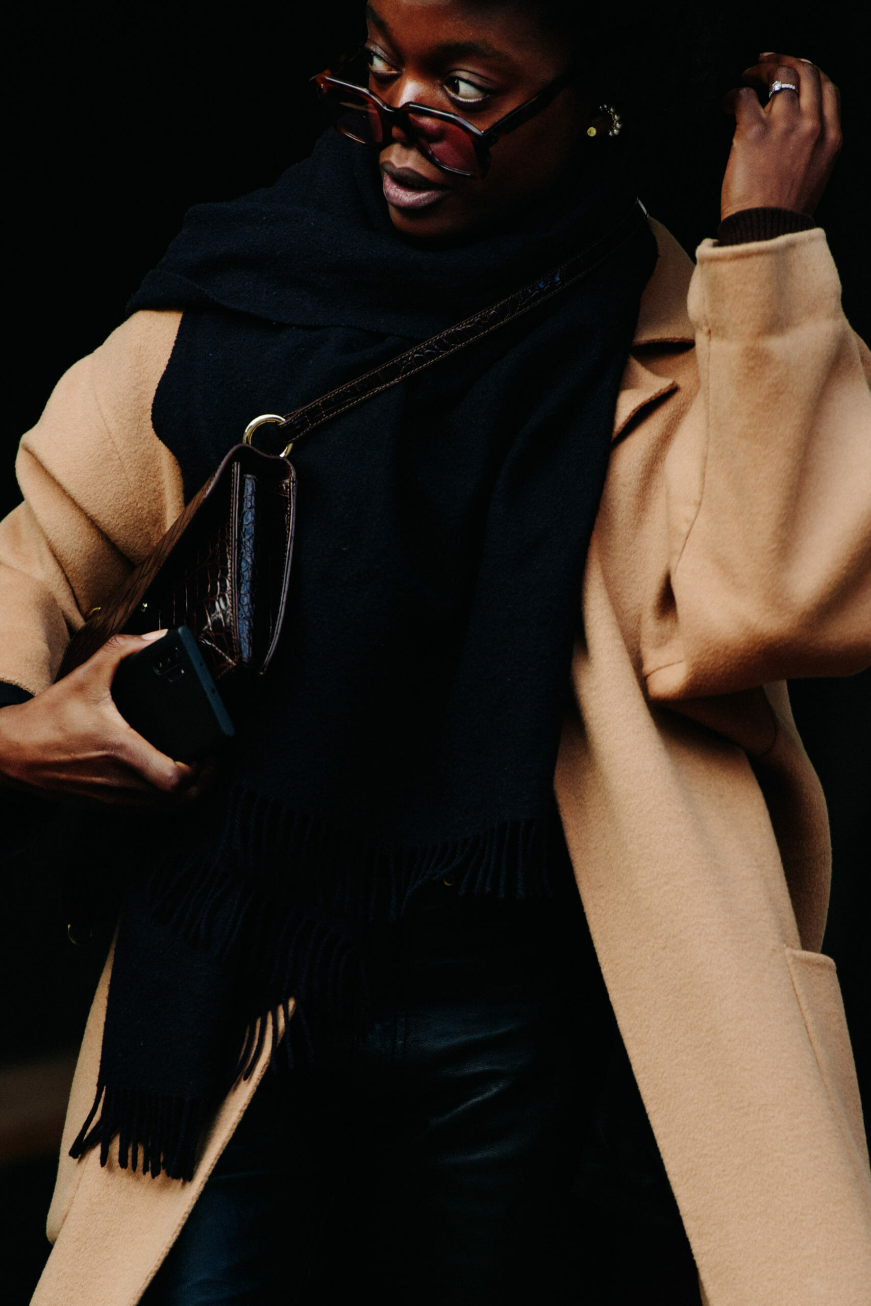 Woman wearing tan coat
