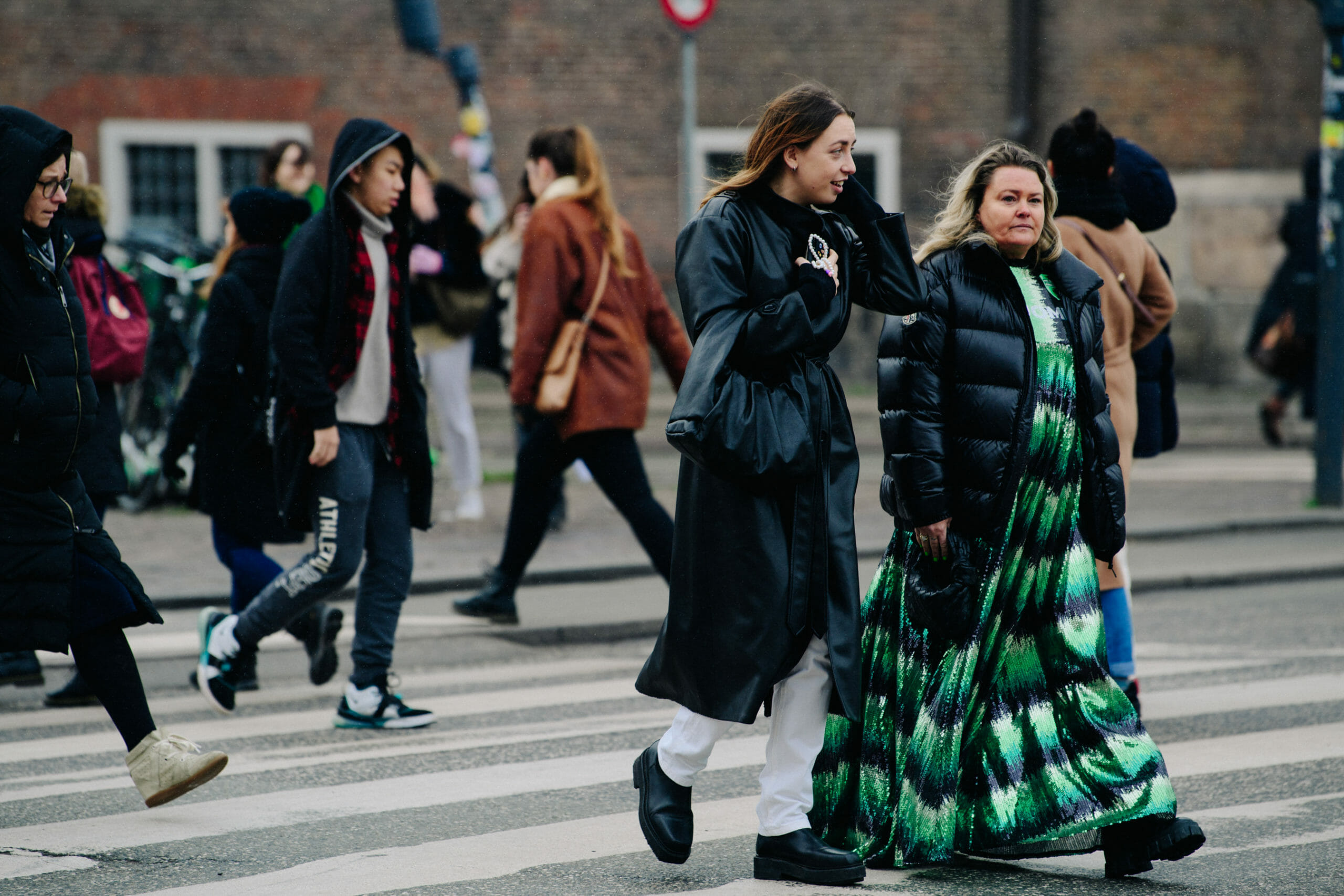 Two women wearing dark coats