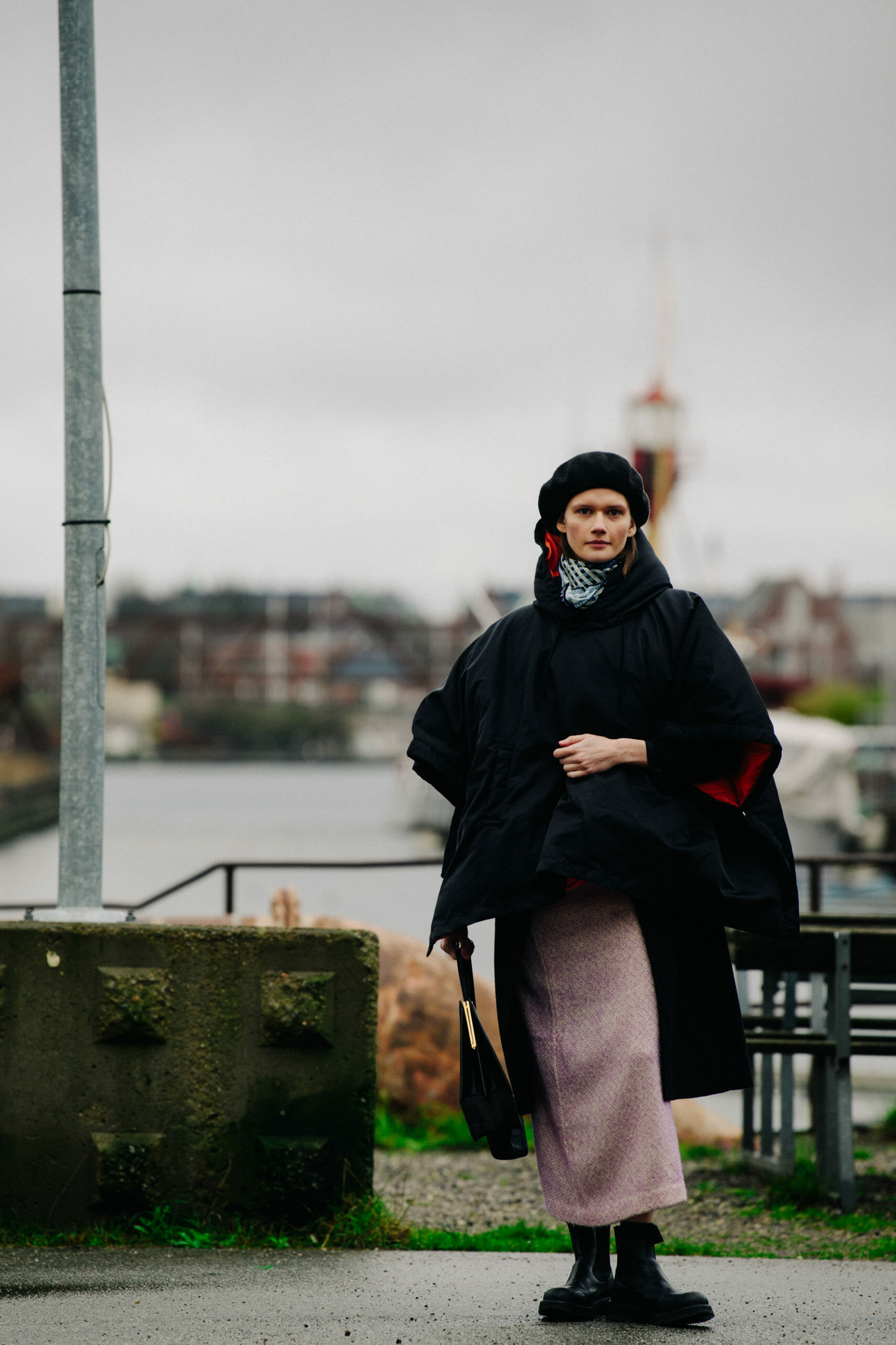 Model wearing black coat