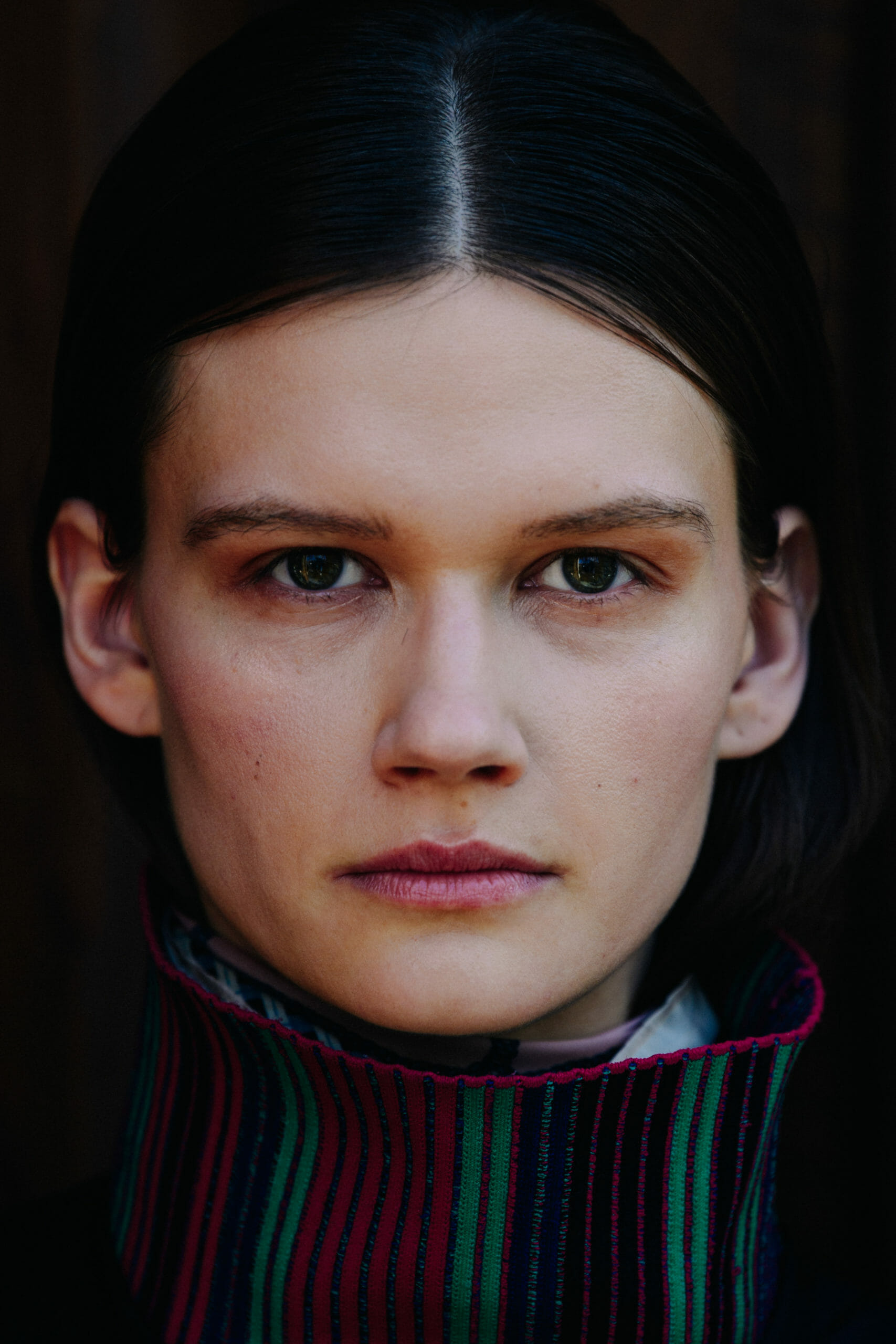 Model with dark hair and eyes