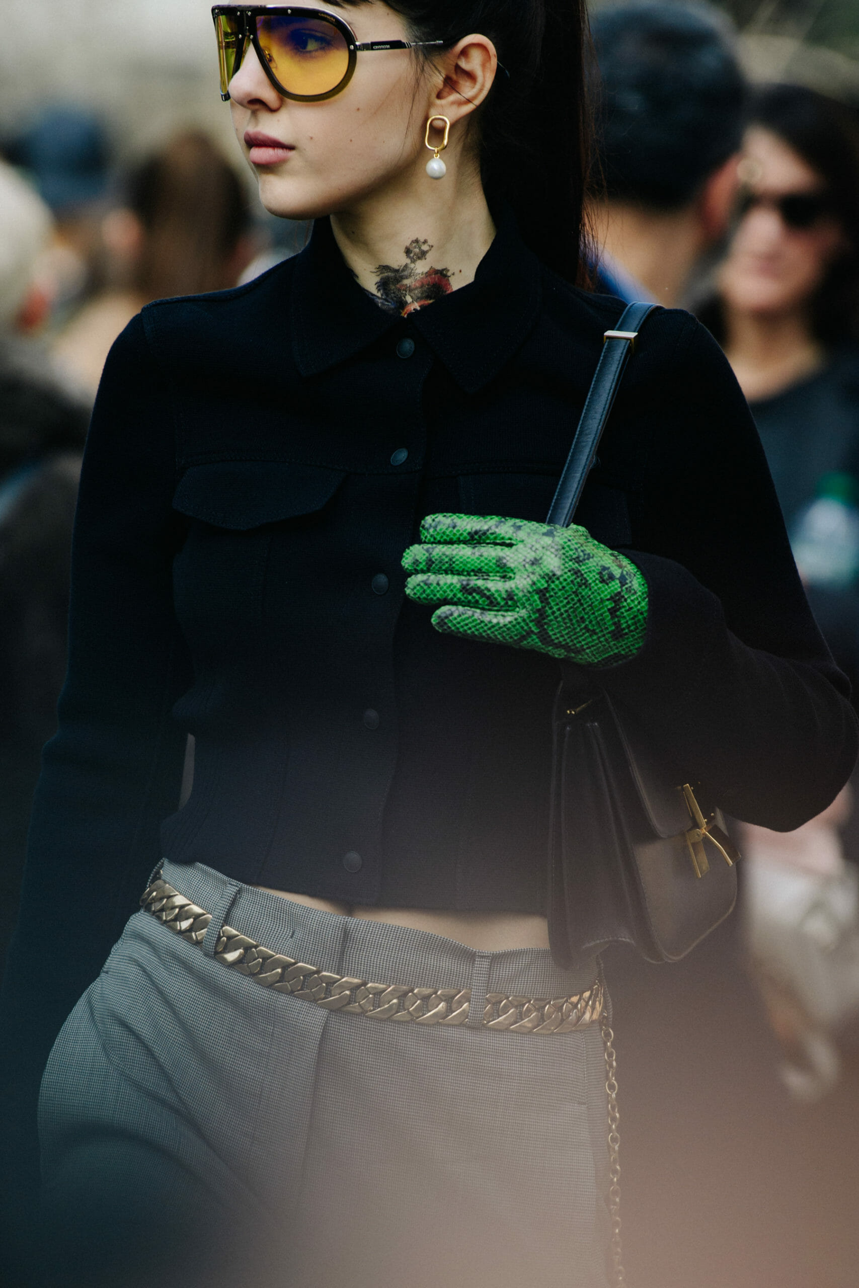 Woman wearing green gloves