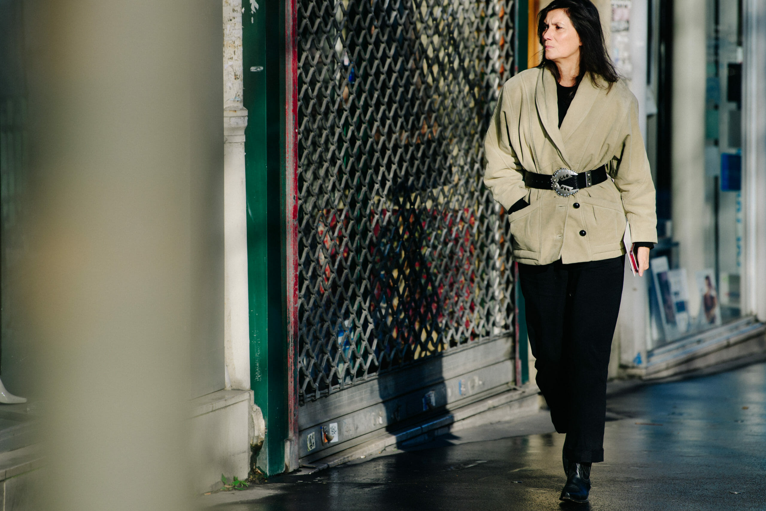 Woman weaing belted jacket