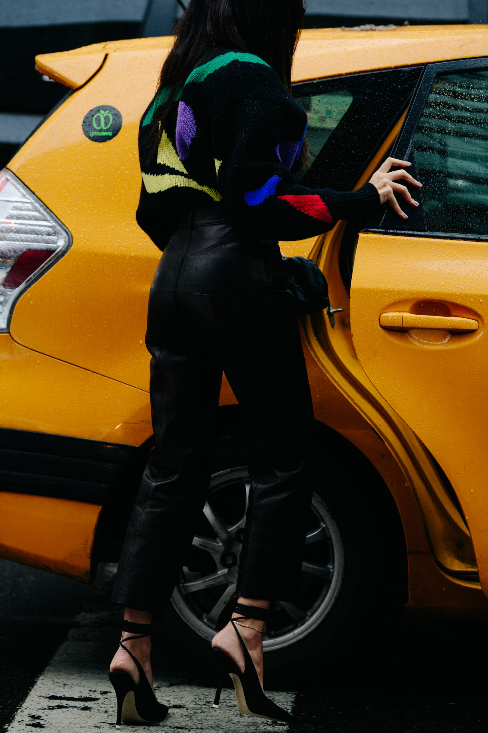 Woman getting into NYC yellow cab