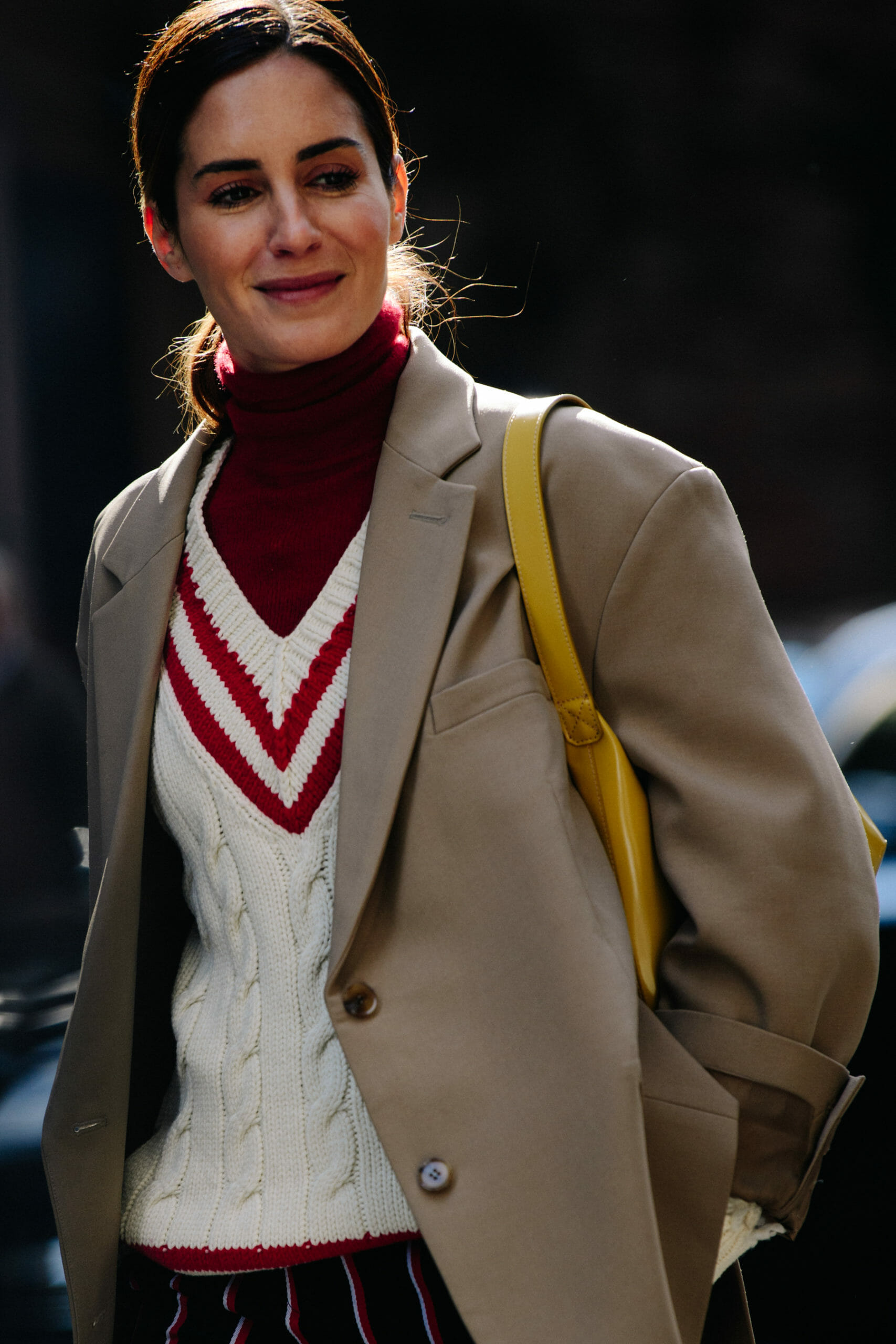 Woman wearing cricket jumper