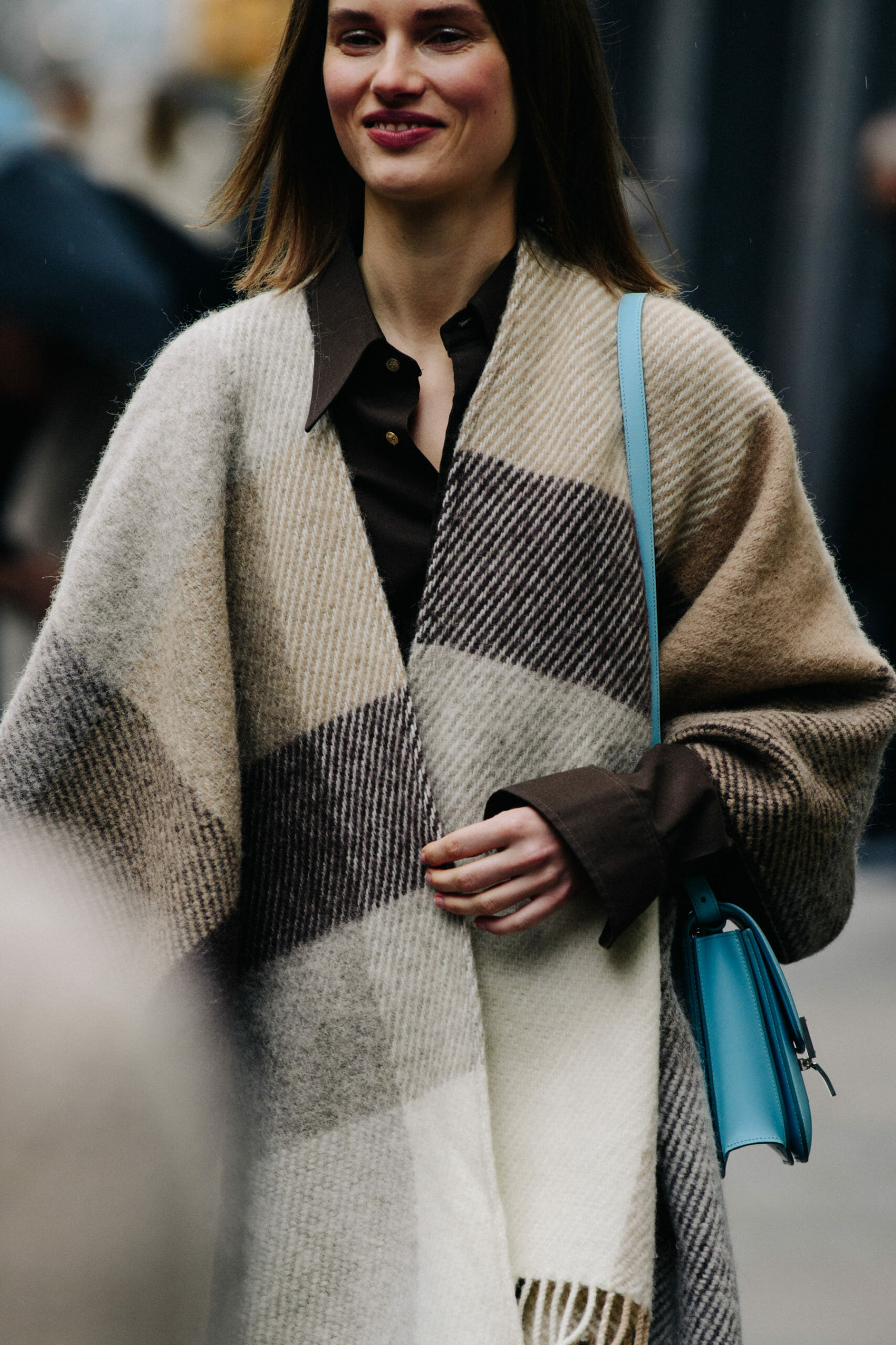 Model wearing blanket