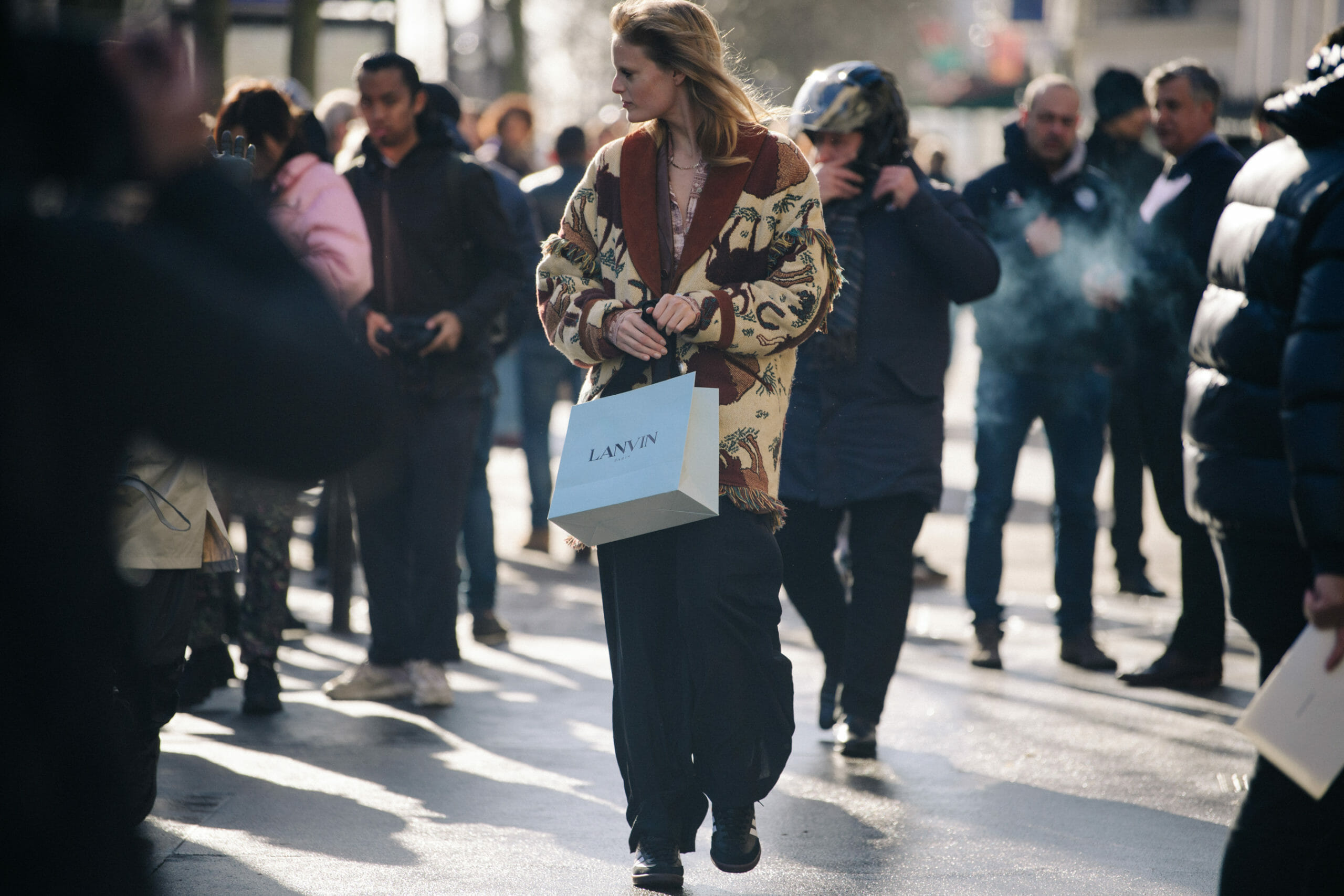 Model wearing brown jacket