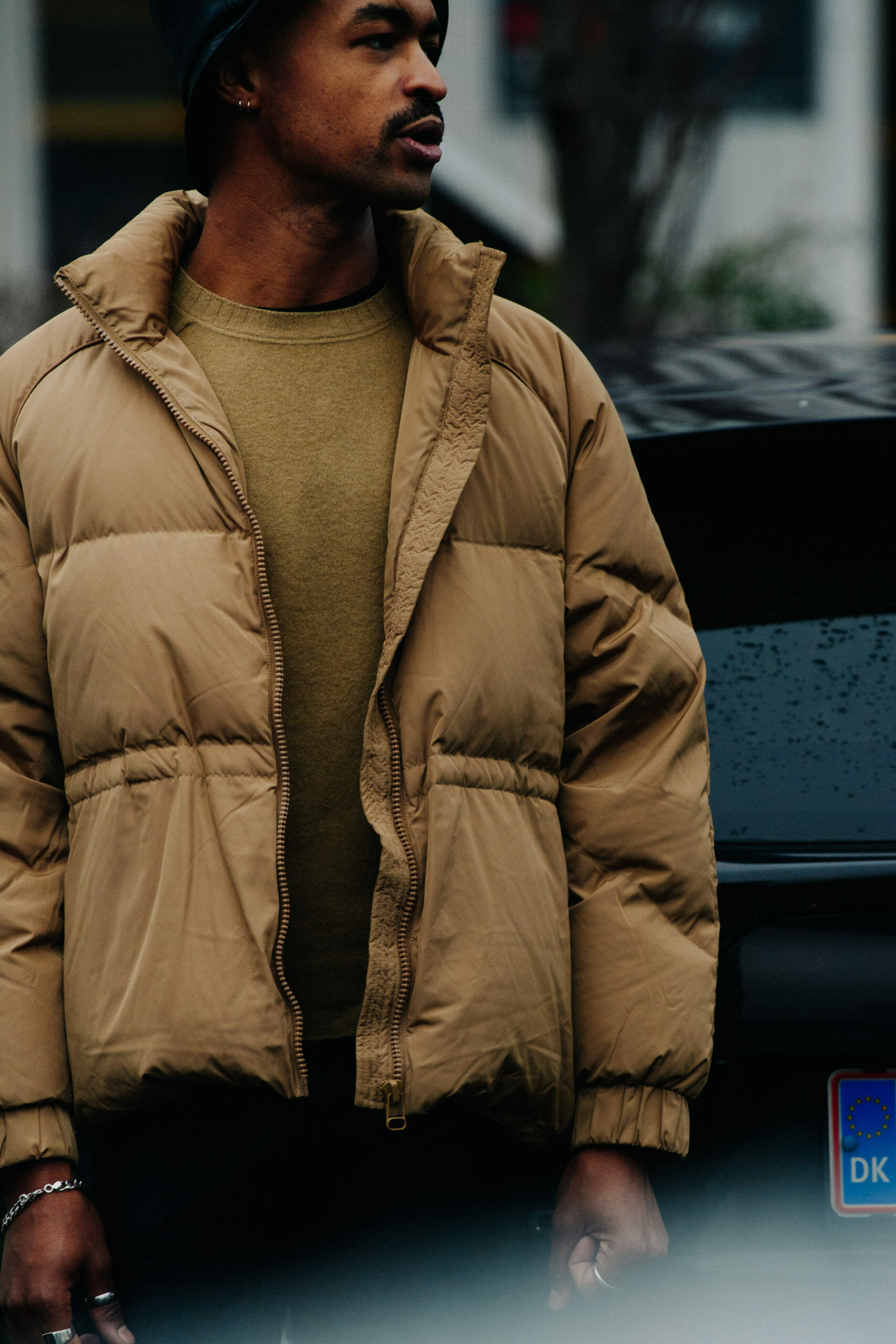 Man wearing brown puffer coat