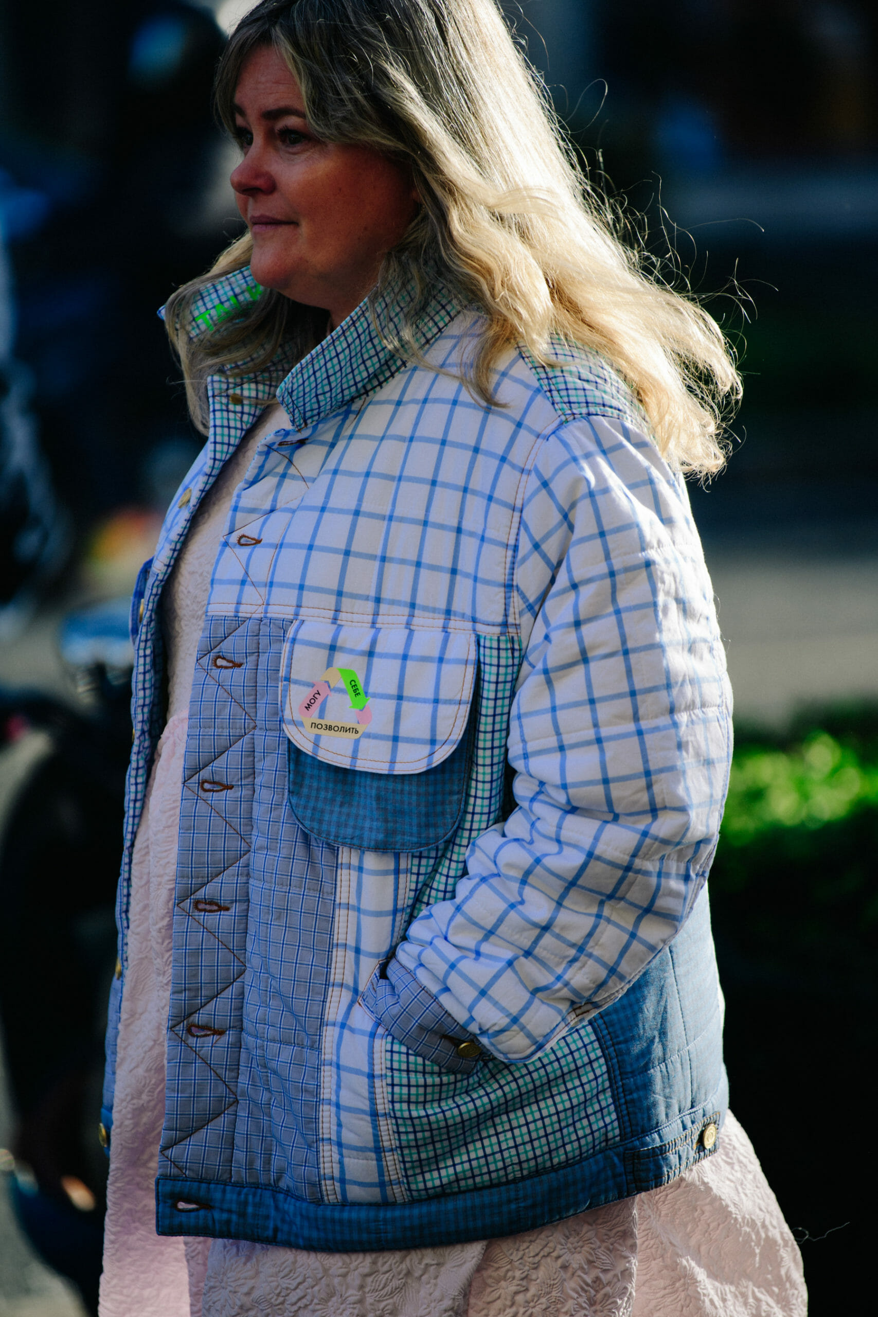 Woman wearing patchwork jacket