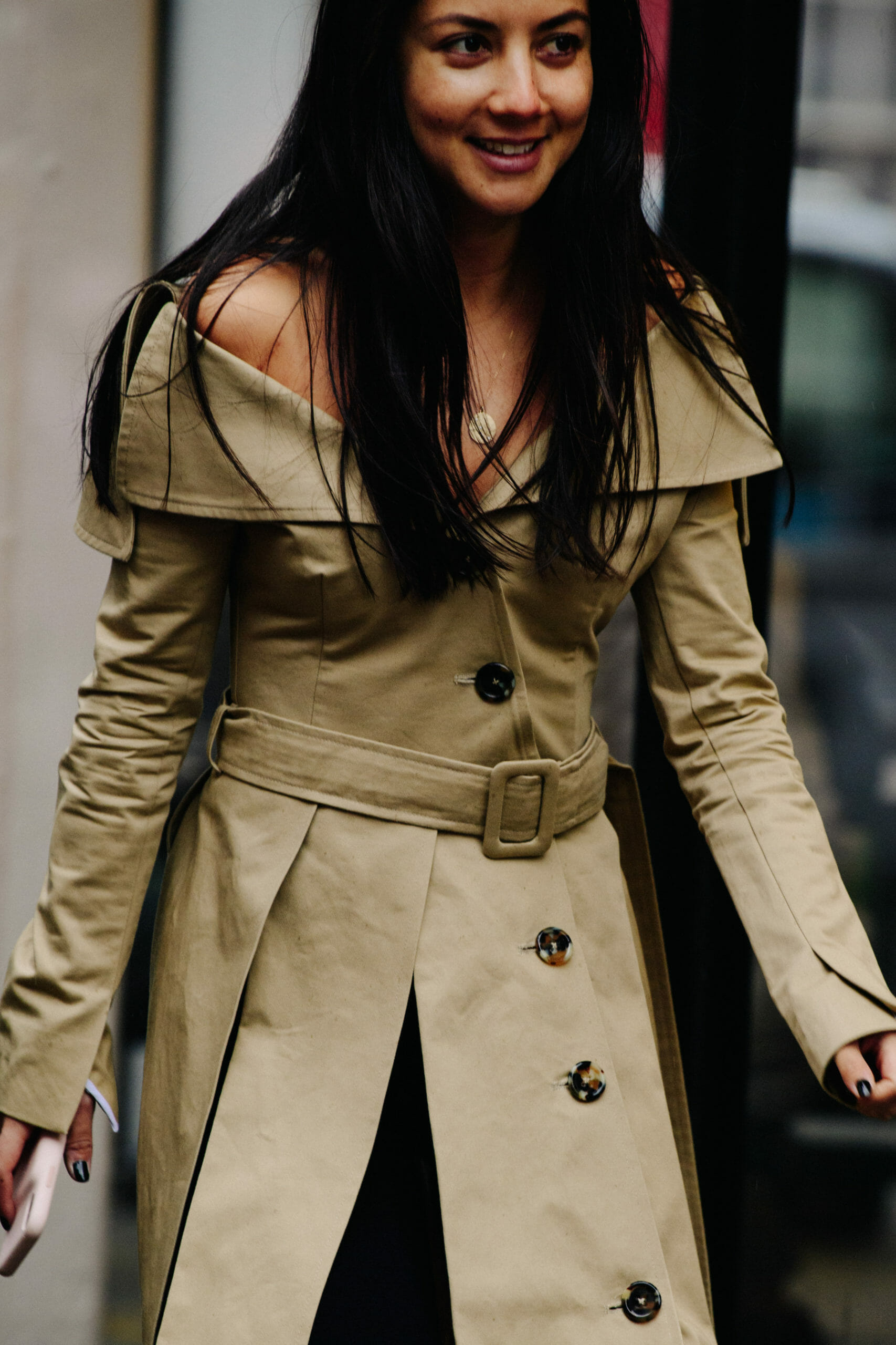 Woman wearing tan coat