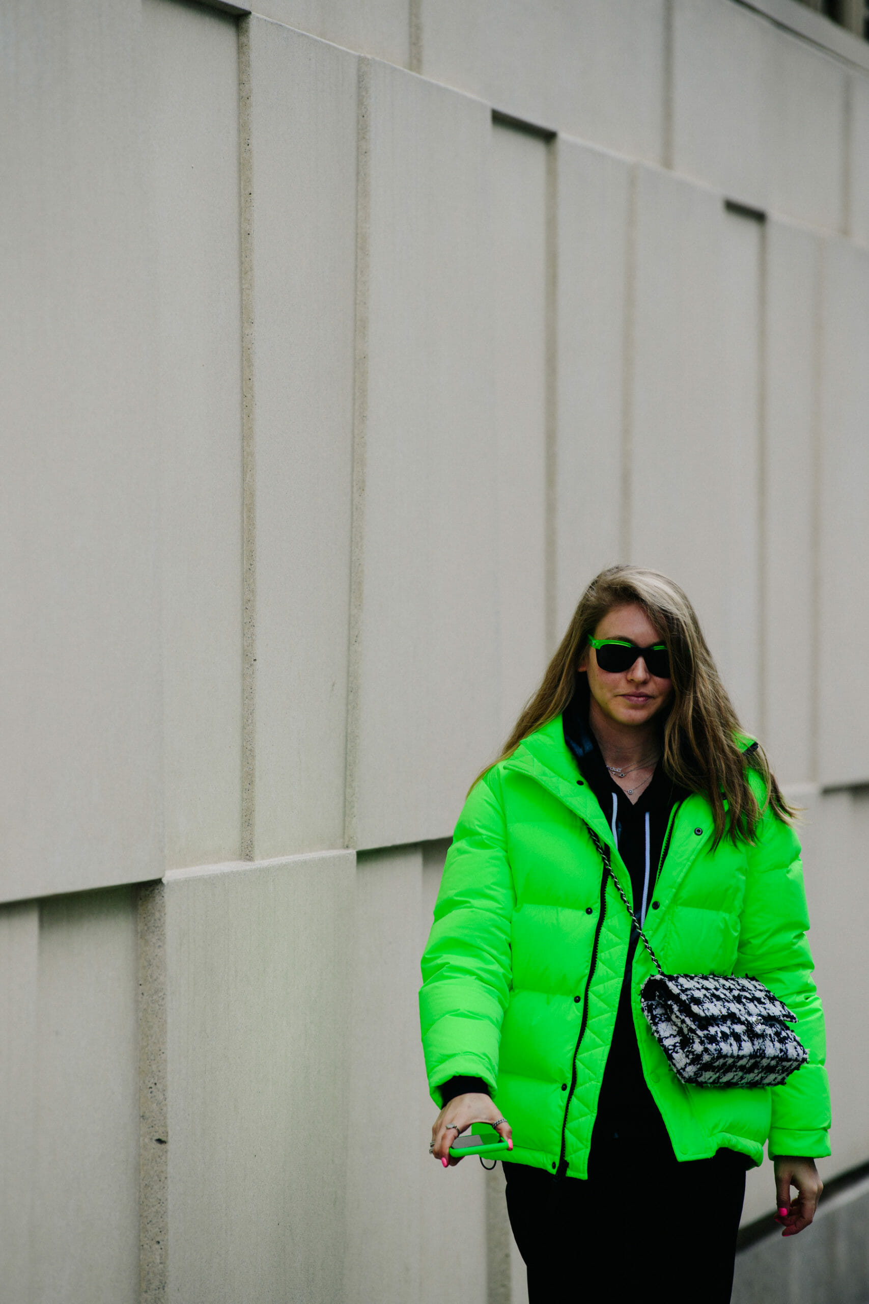 Woman wearing bright green coat