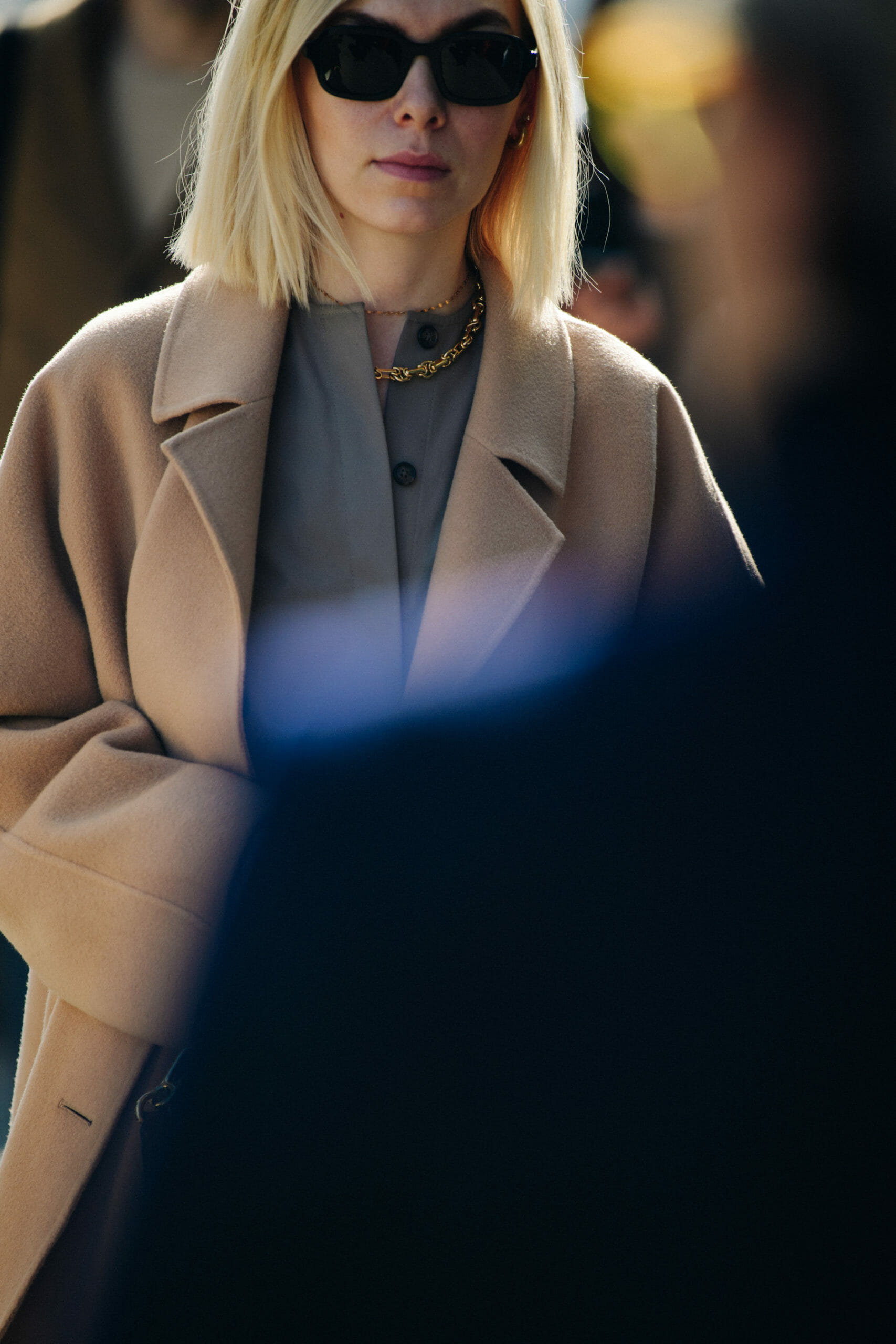 Woman wearing tan coat