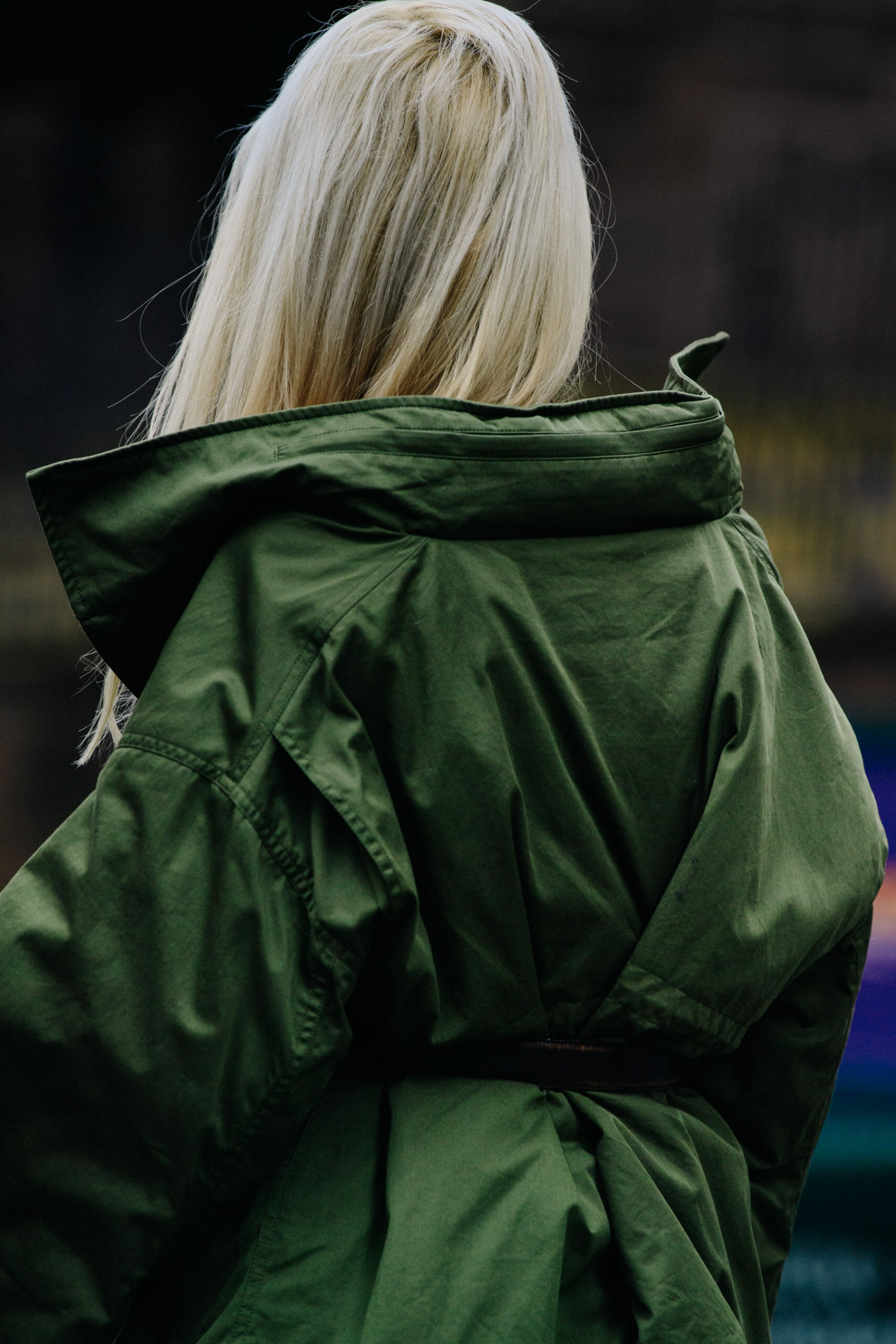 Woman wearing green jacket