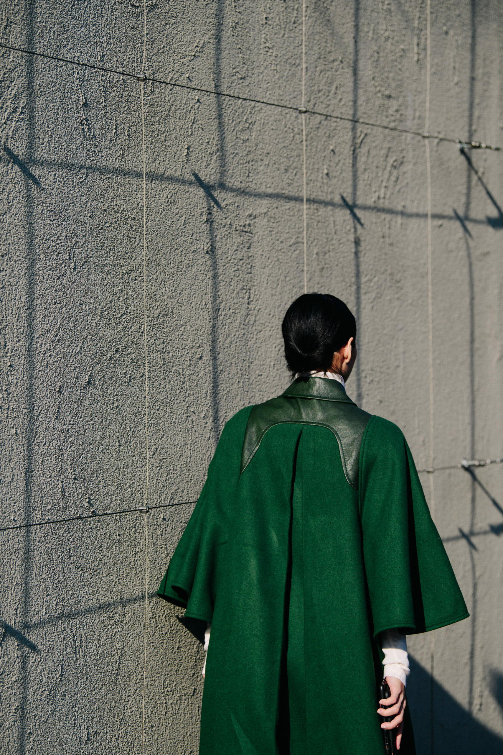Woman wearing green coat