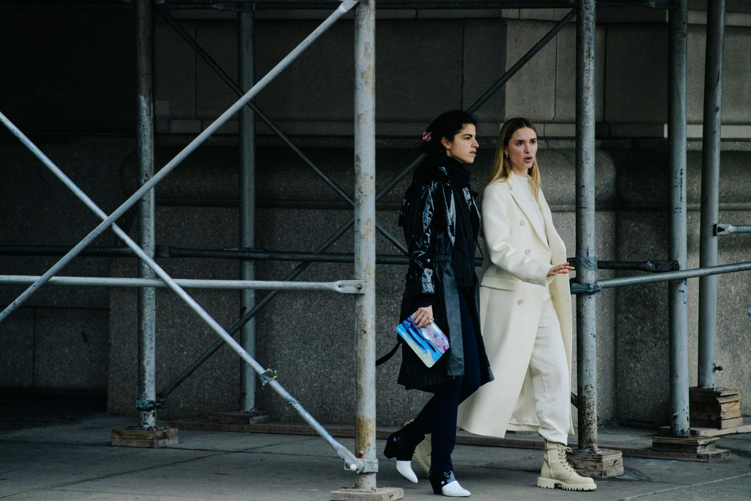 Two women wearing white and black