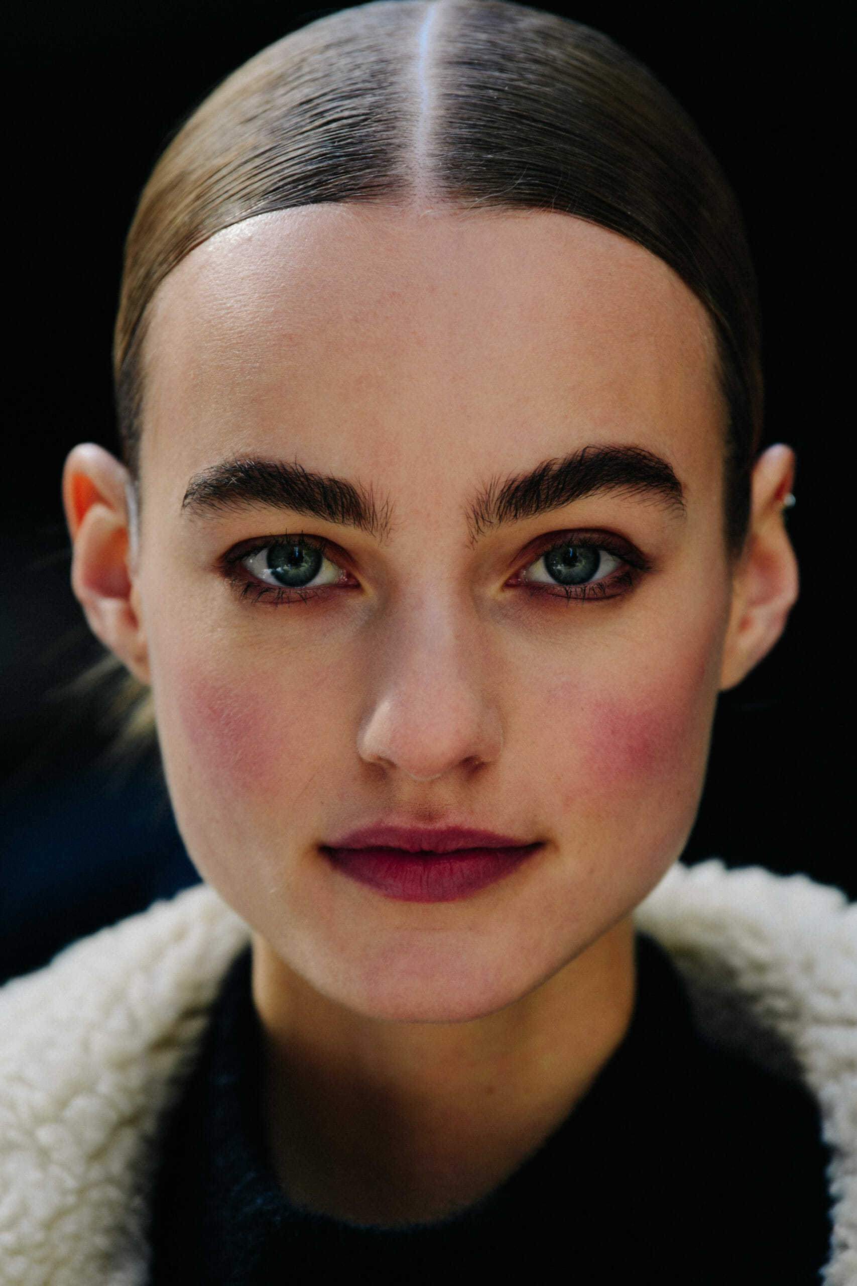 Model with bushy eyebrows