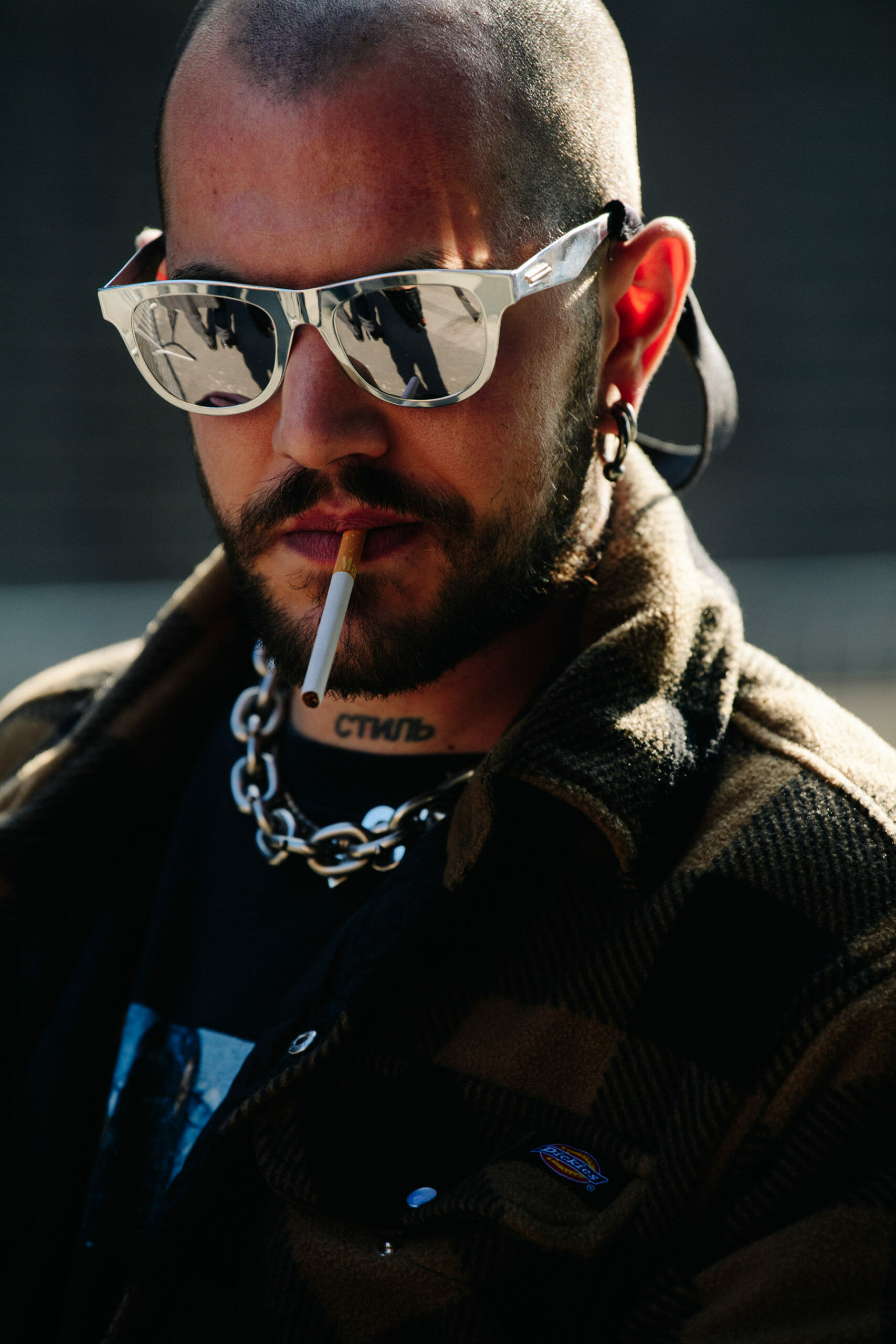 Man wearing reflective glasses