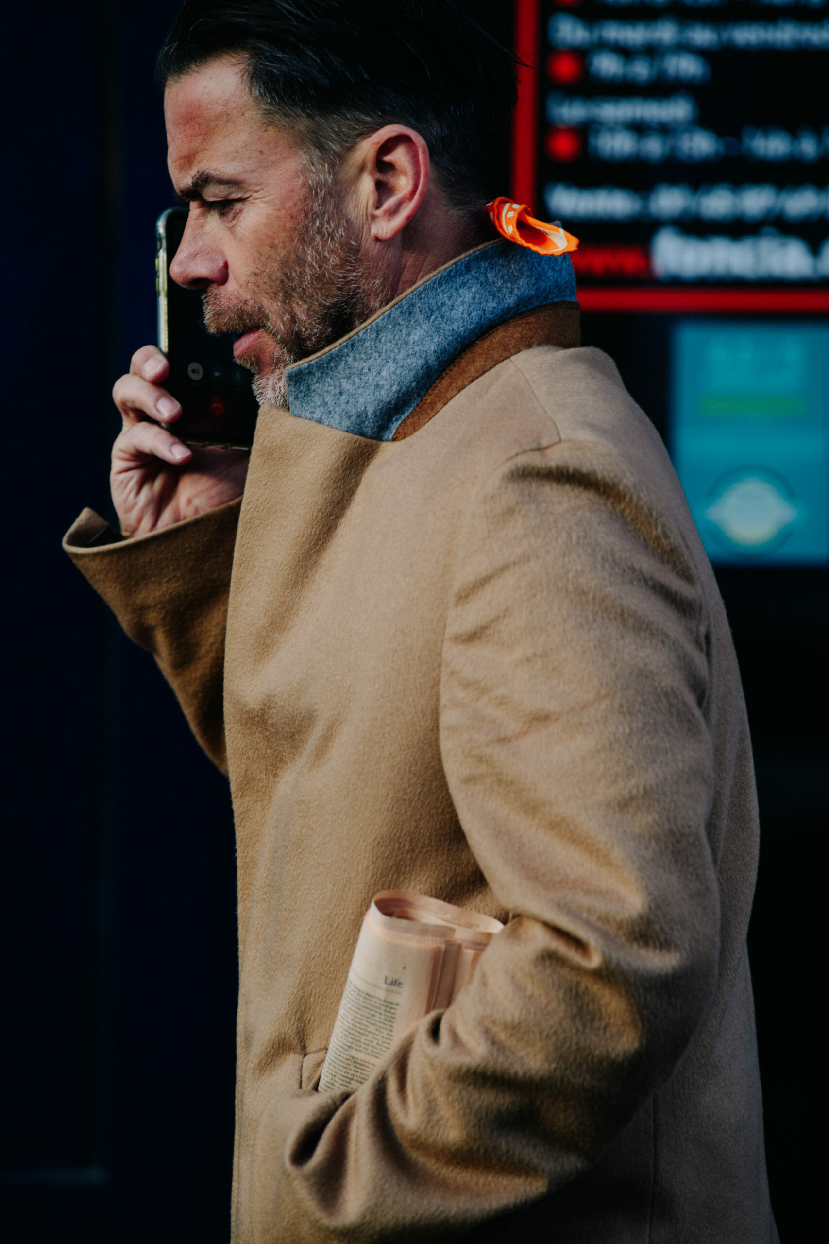 Man wearing tan coat
