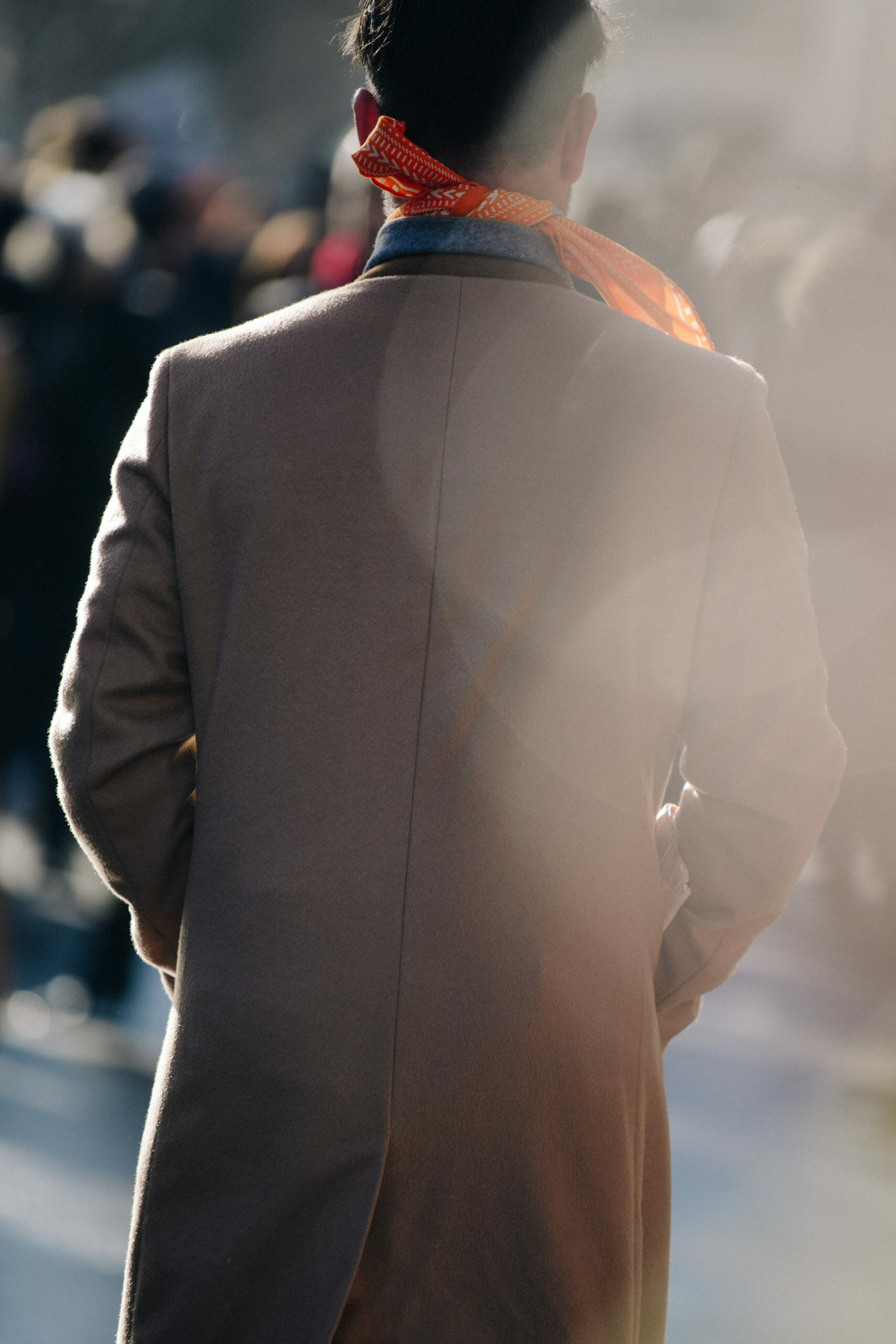 Man wearing tan coat