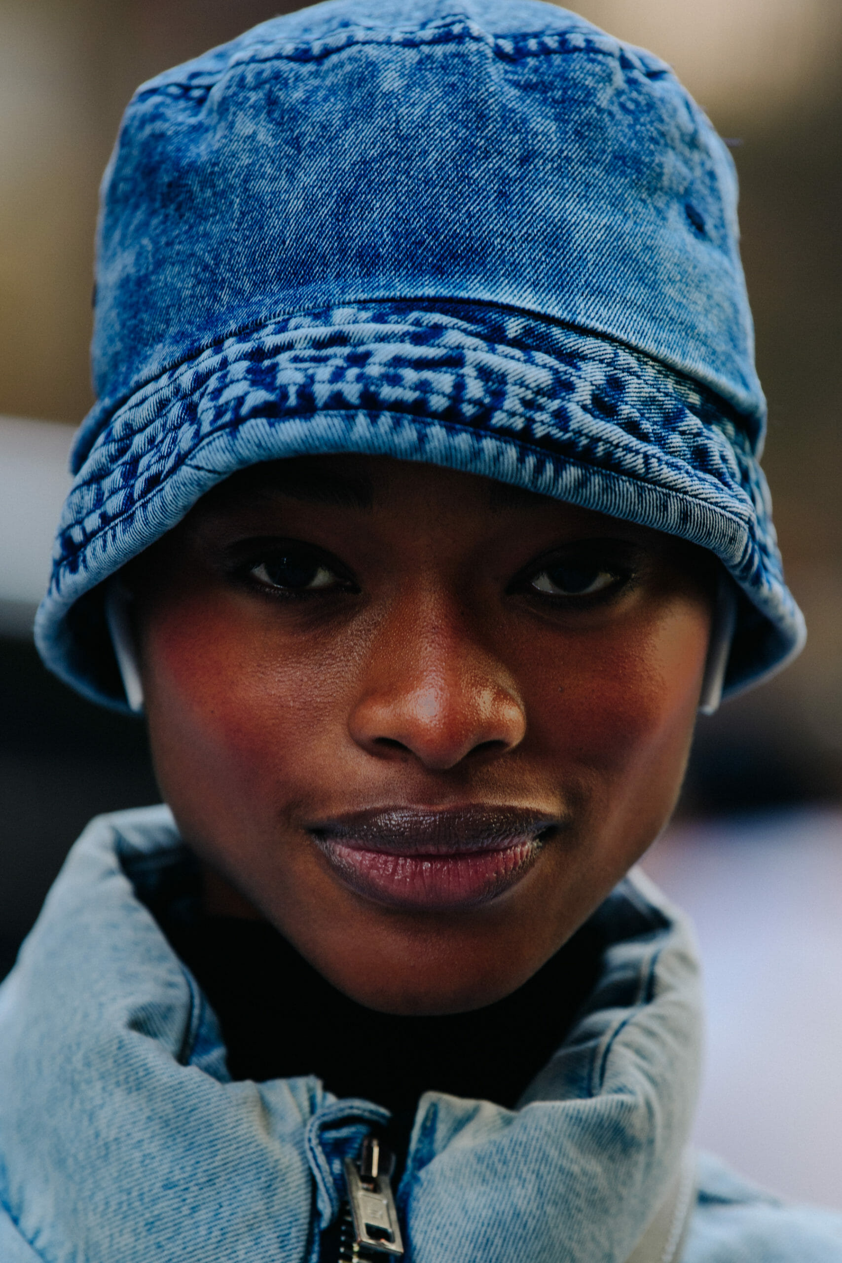 Model wearing denim hat
