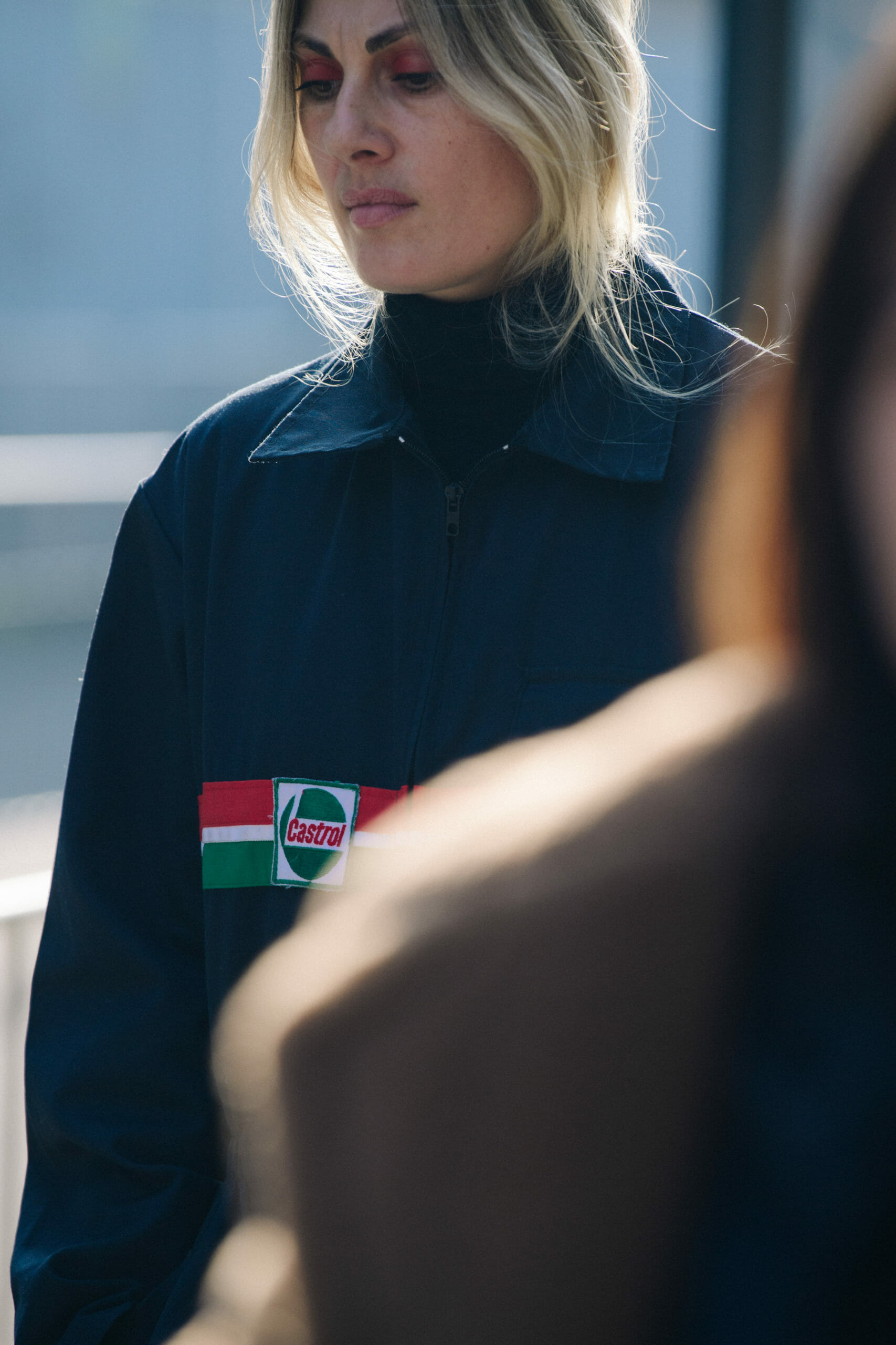 Woman wearing mechanics jacket