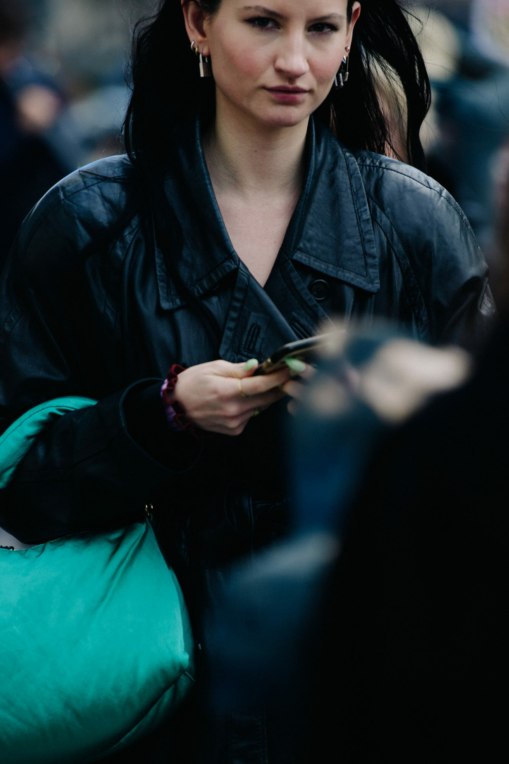 Woman carrying green bag