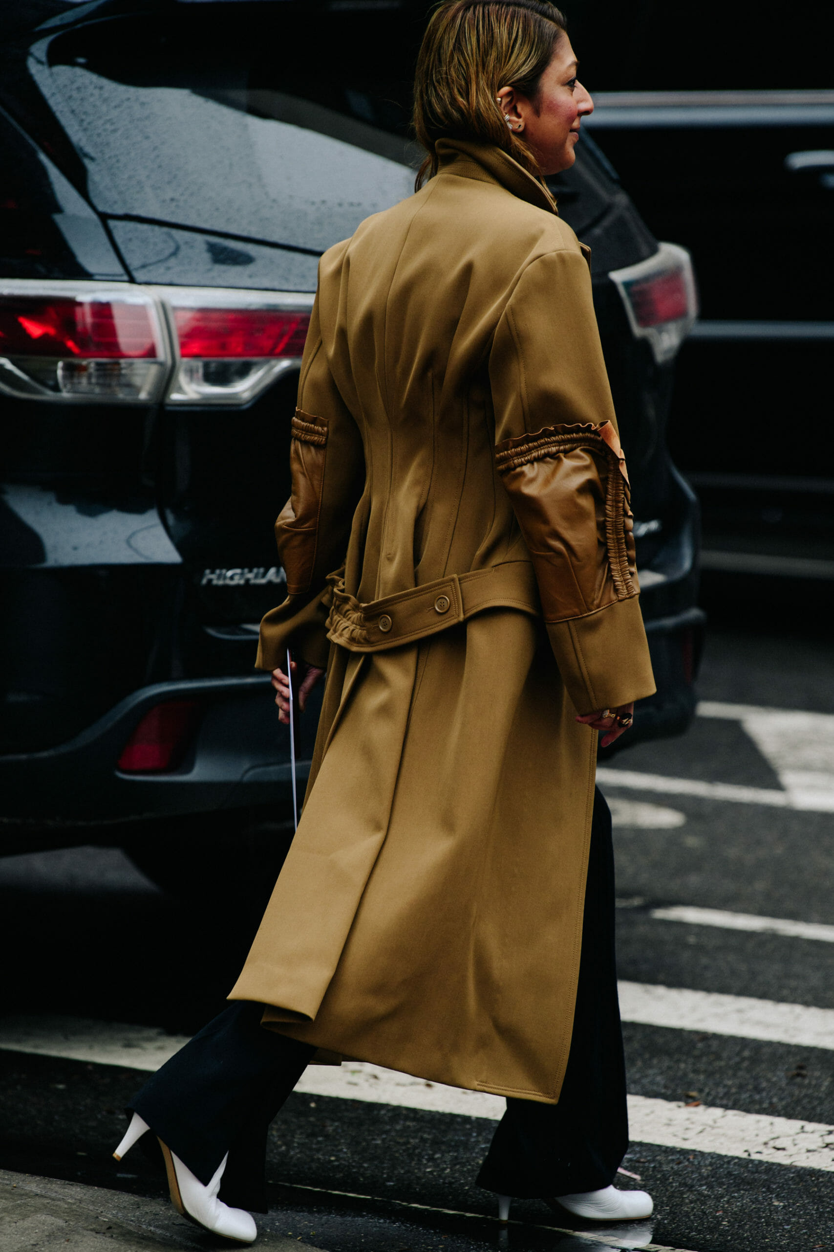 Woman wearing tan coat