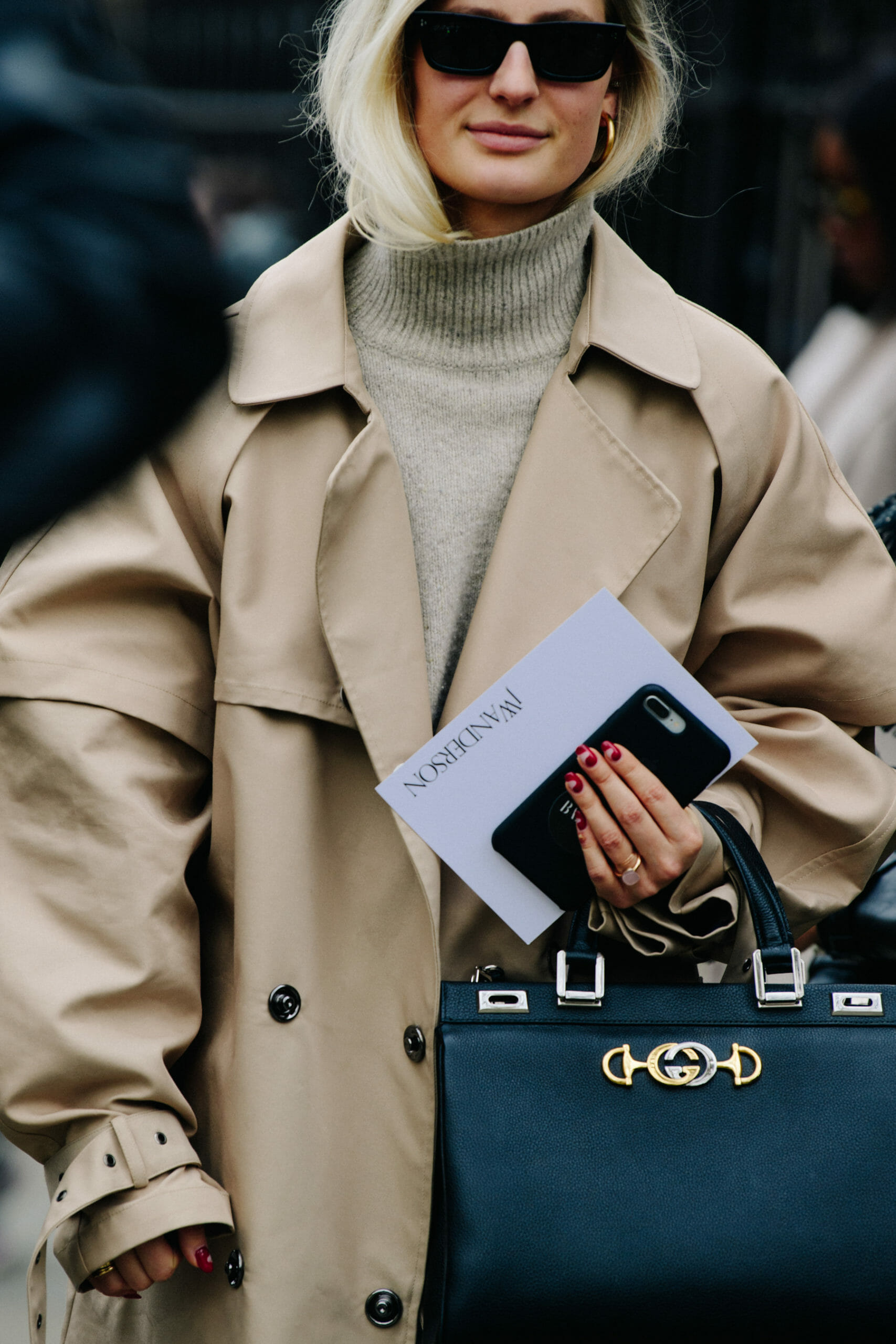 Woman wearing tan coat