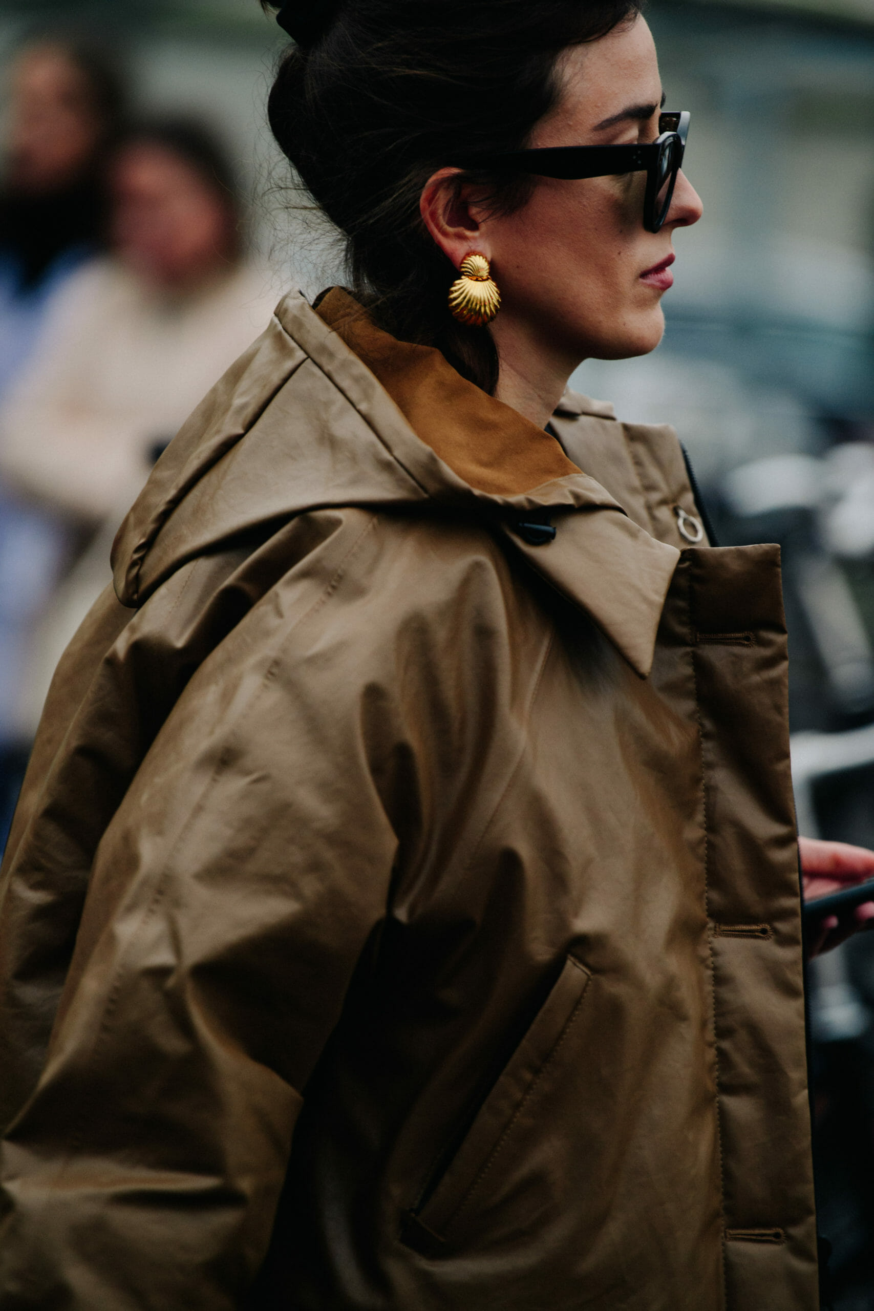 Woman wearing brown coat