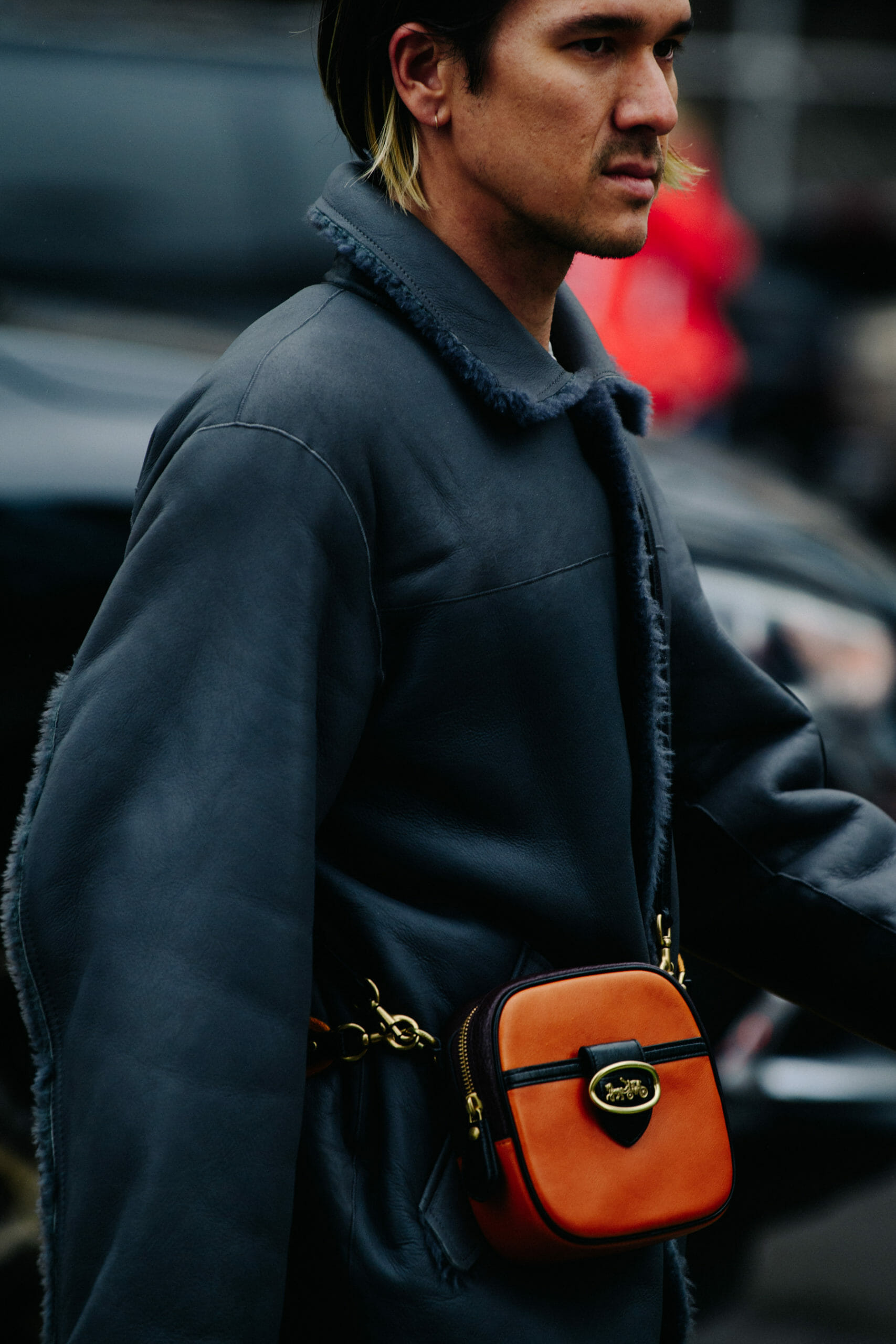Man carrying Coach bag