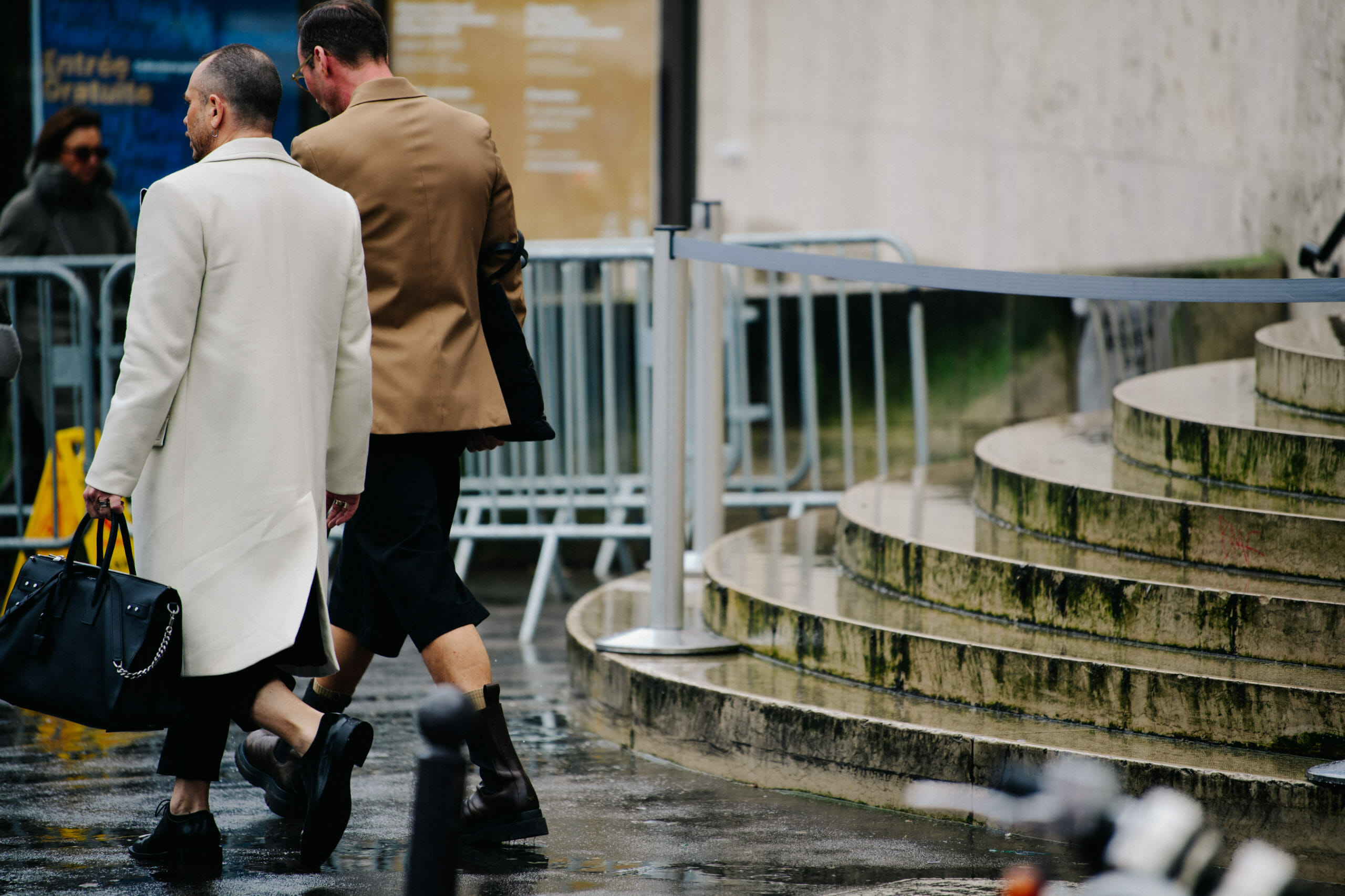 Two men wearing black shoes