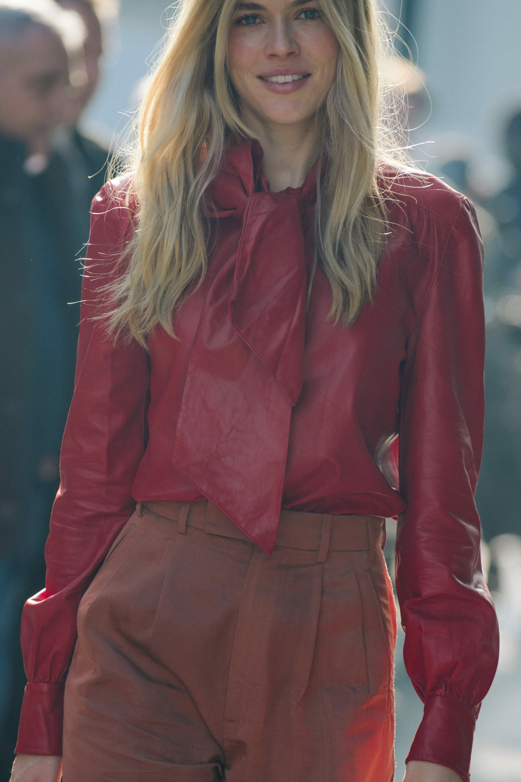 Woman wearing red leather shirt