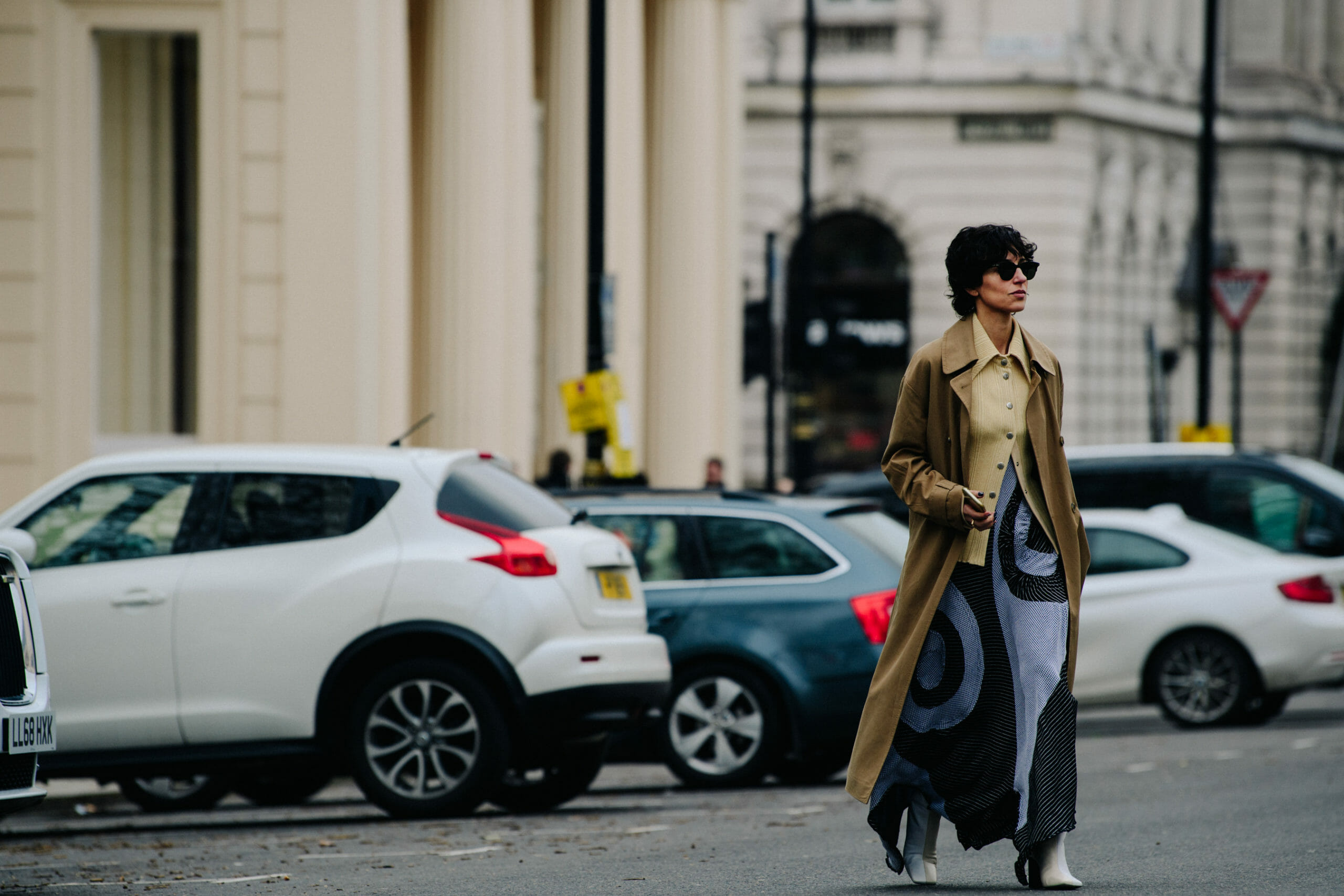Editor wearing tan coat