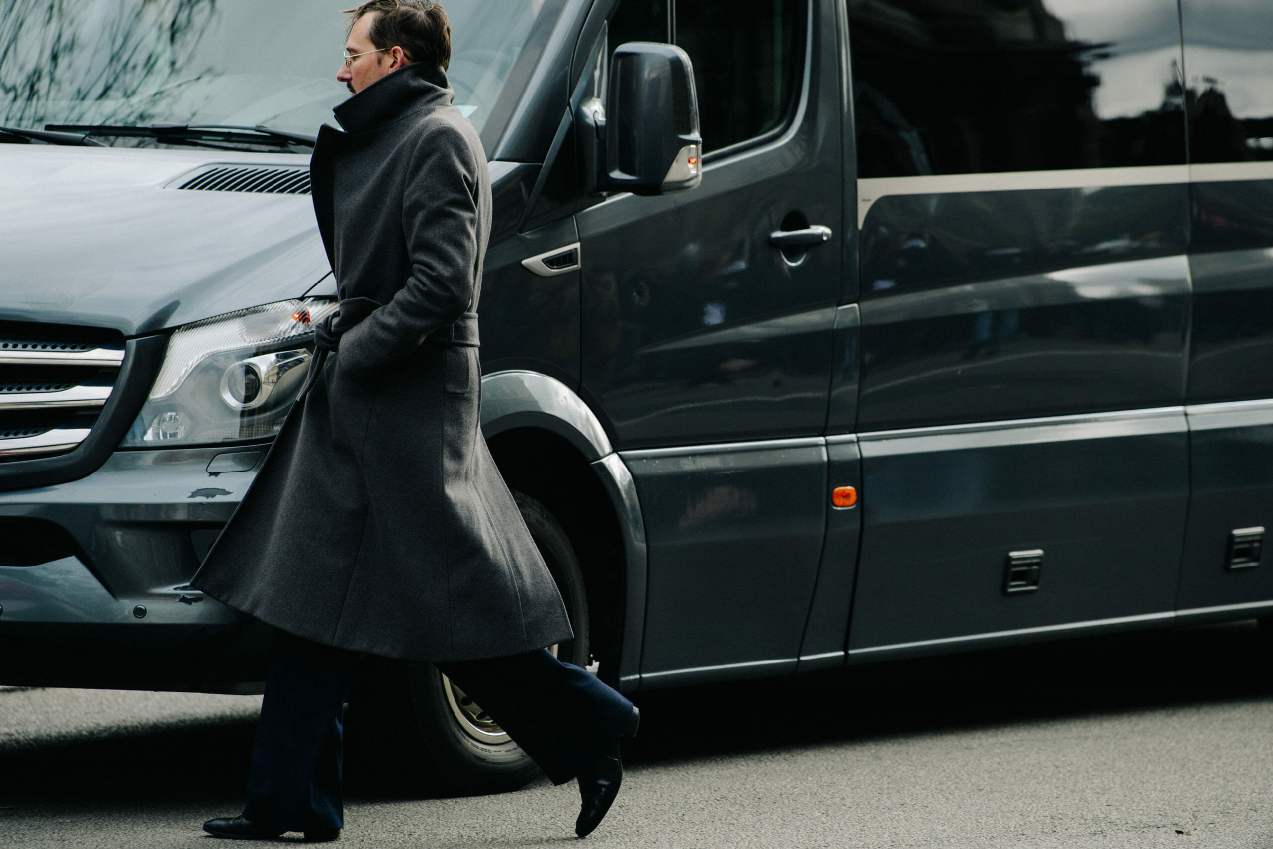 Man wearing grey coat