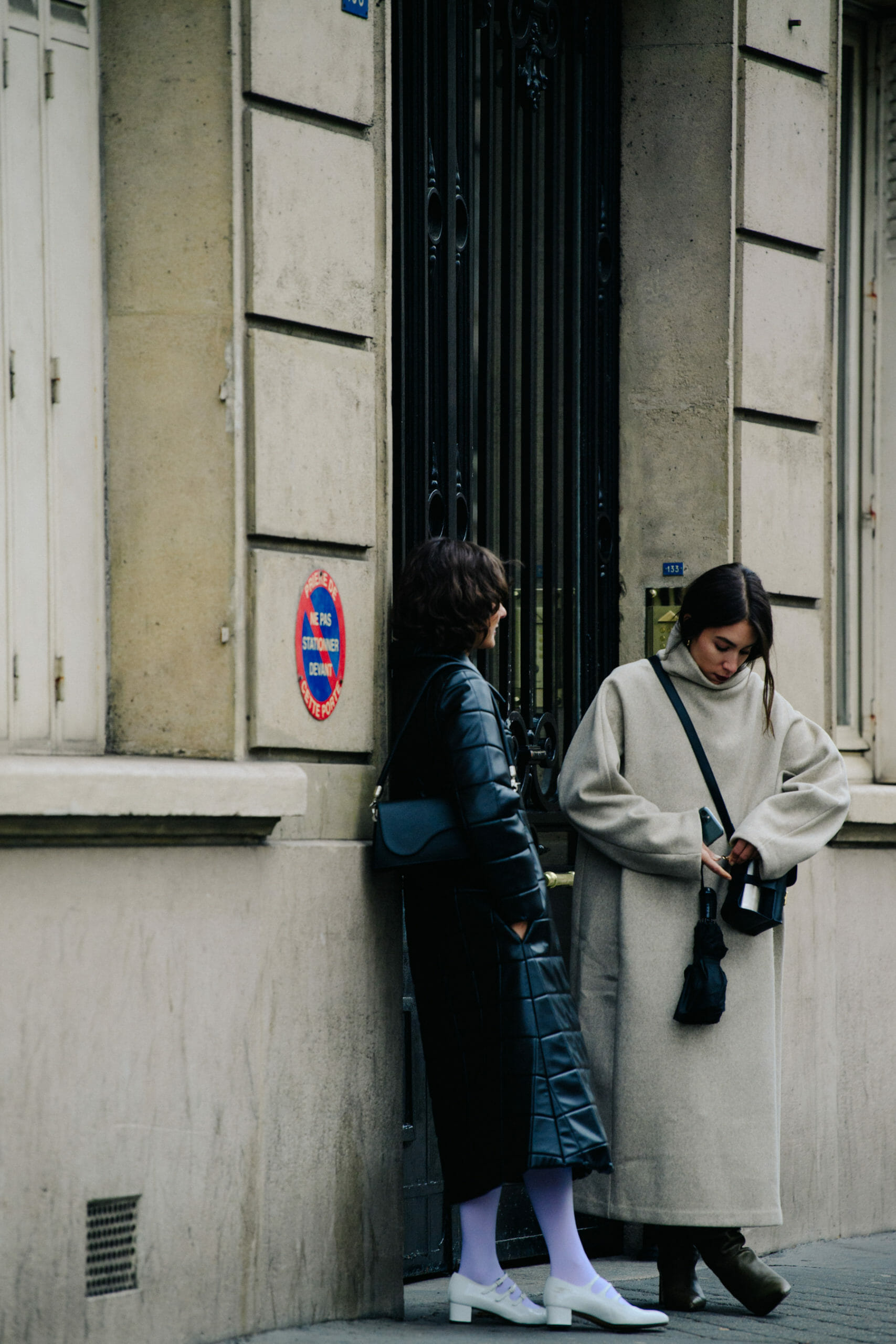 Two women wearing black and grey