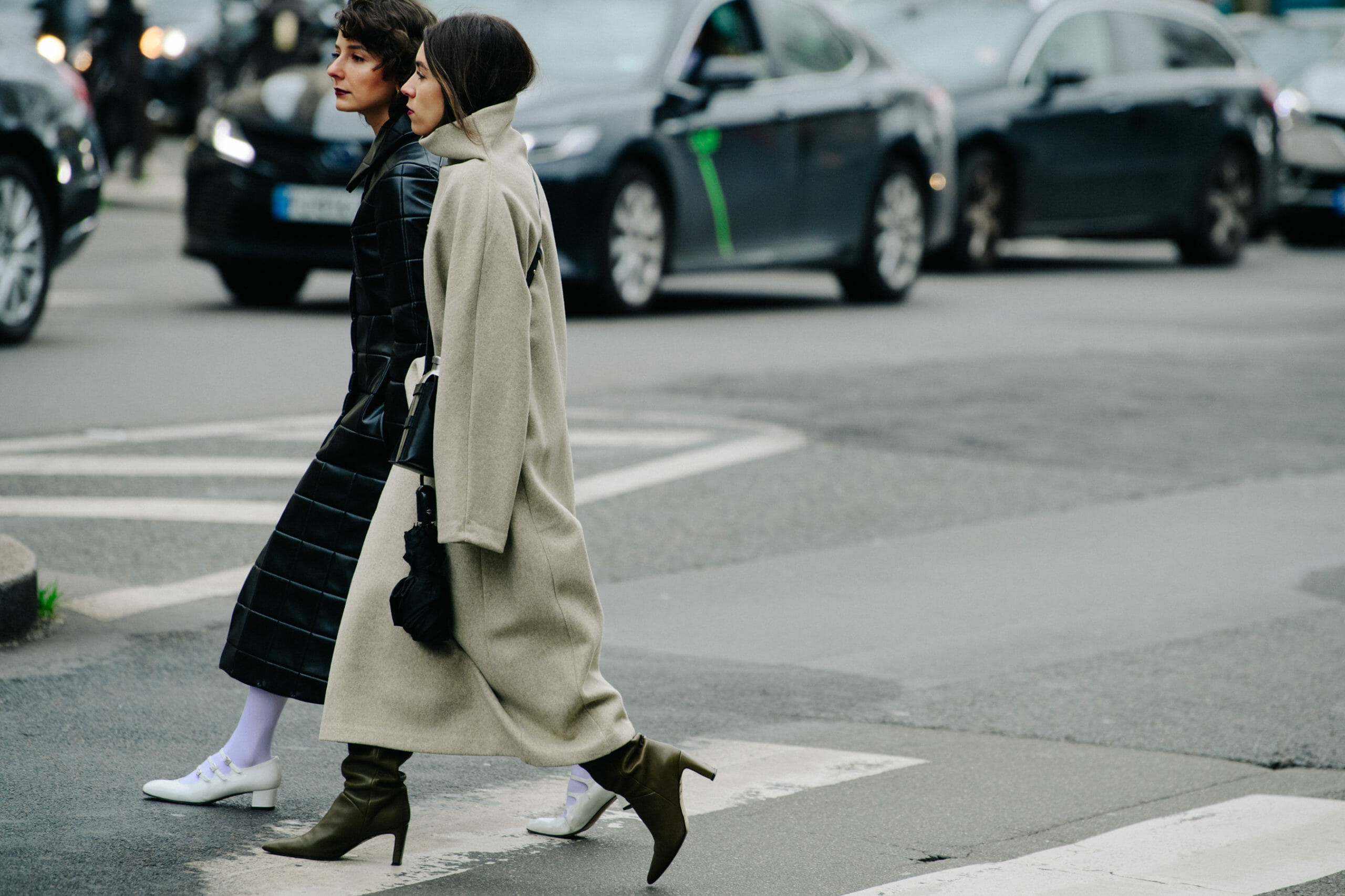 Two women wearing black and grey