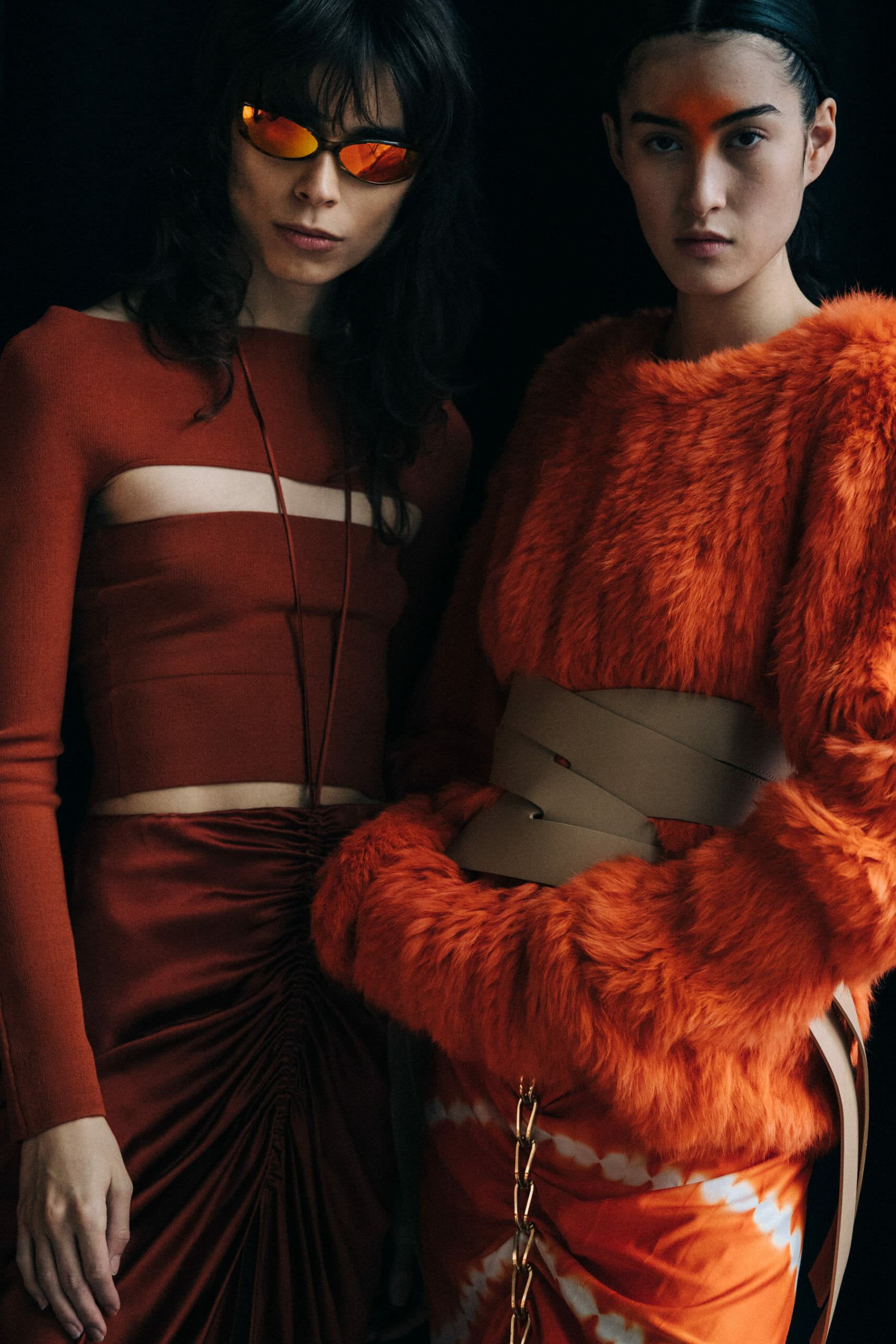 Model wearing orange Dion Lee outfit