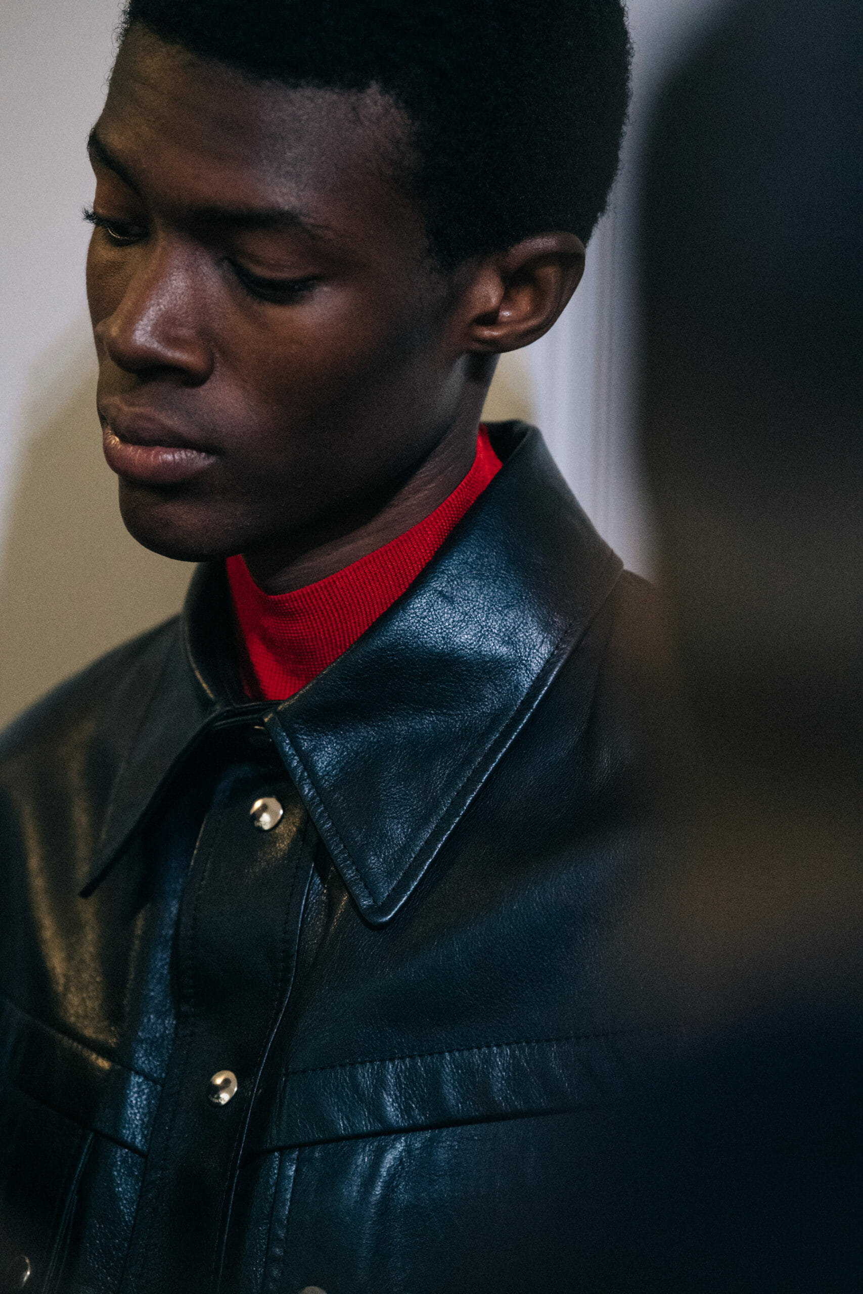 Model wearing black jacket at Givenchy